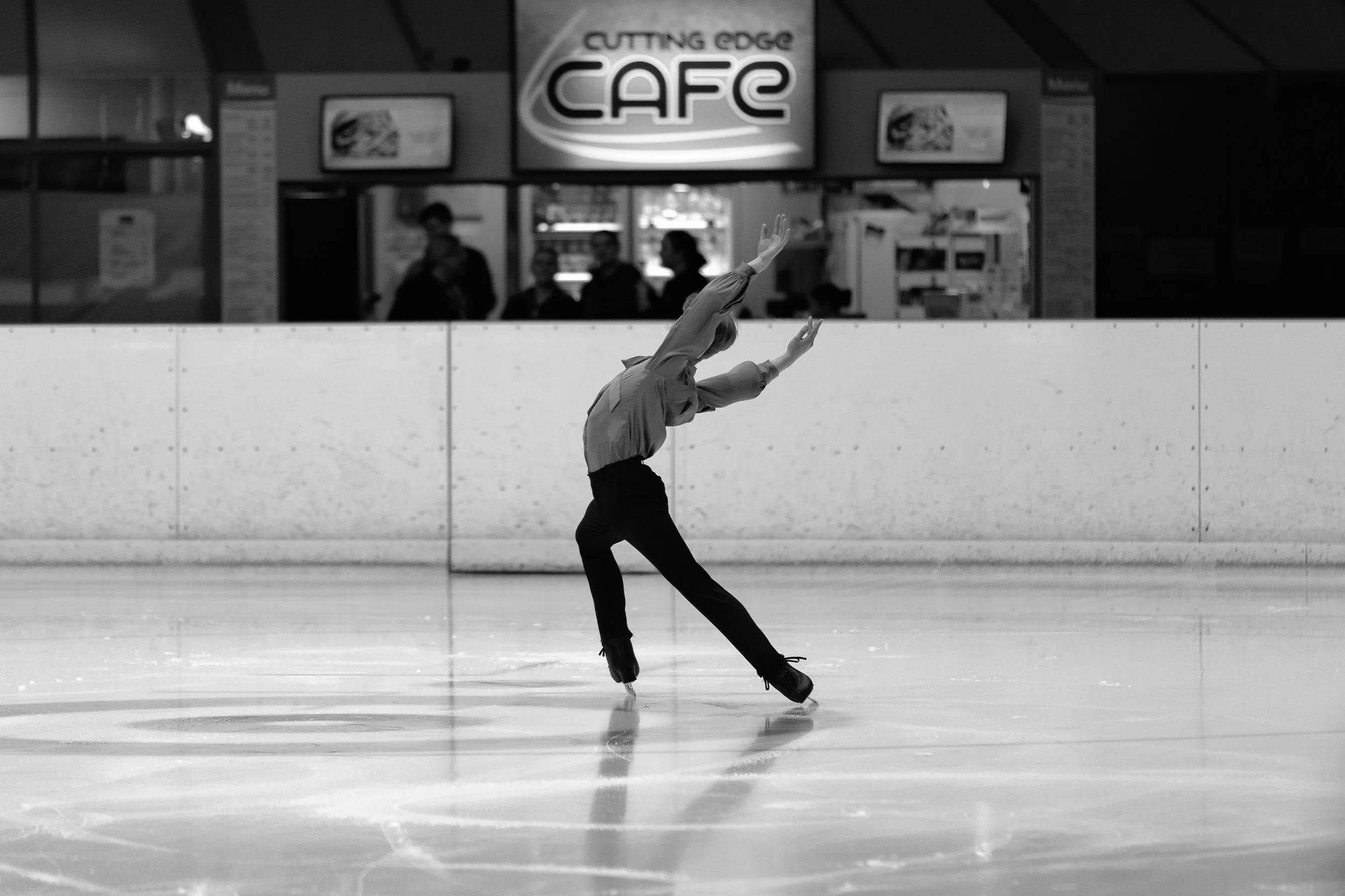 Emery Kaison performing an Ina Bauer on the ice at Erina Ice Arena.