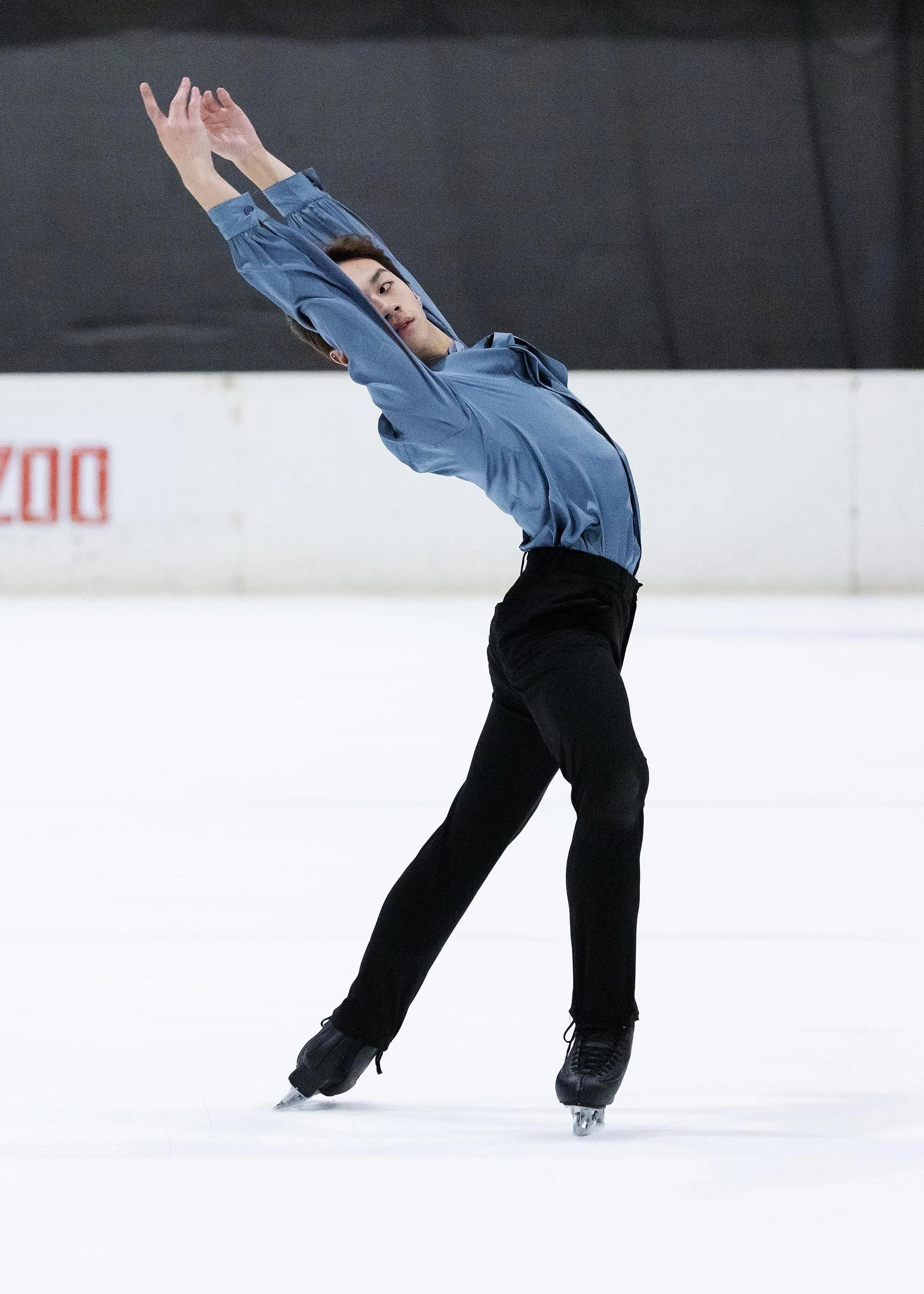 Emery Kaison performing an Ina Bauer on the ice from the Daily Telegraph.
