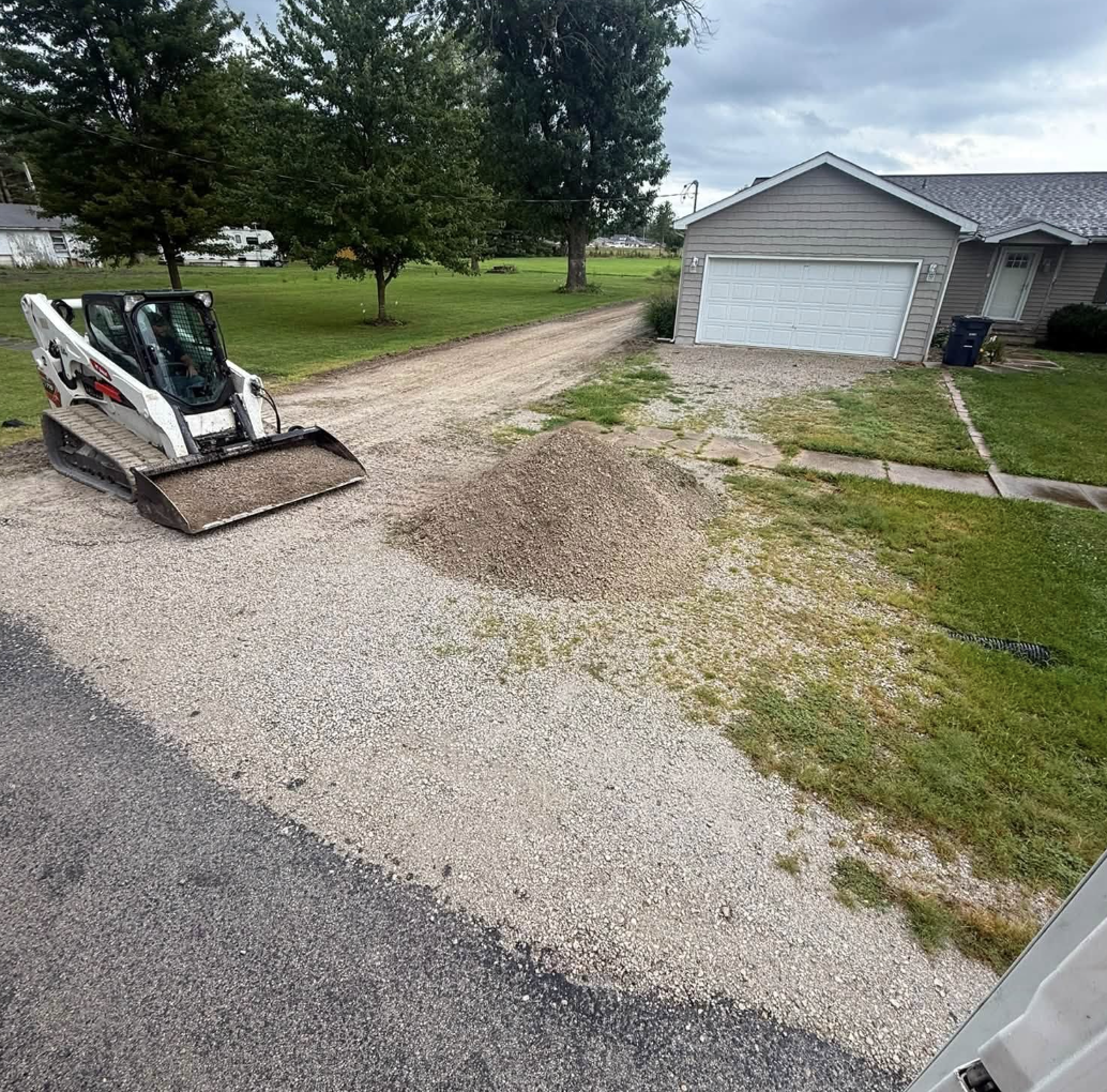 3D Excavating skid steer grading and preparing a residential gravel driveway in Illinois.