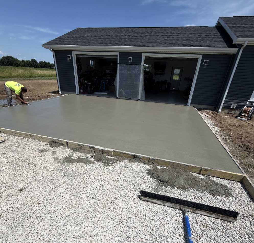 Fresh concrete pad installation completed by 3D Excavating for a residential property in Illinois.