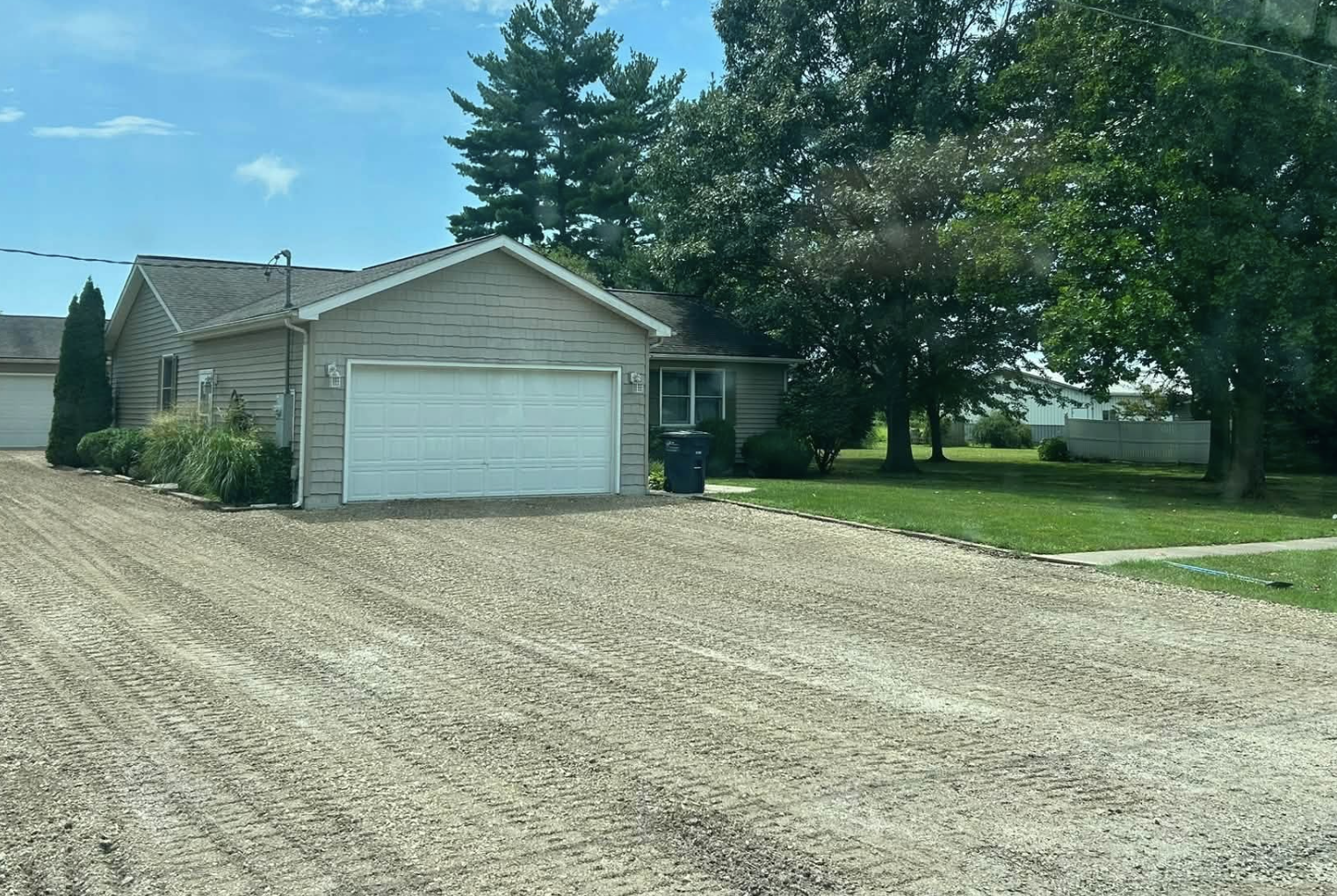 Completed gravel driveway installation by 3D Excavating with a freshly graded aggregate surface.
