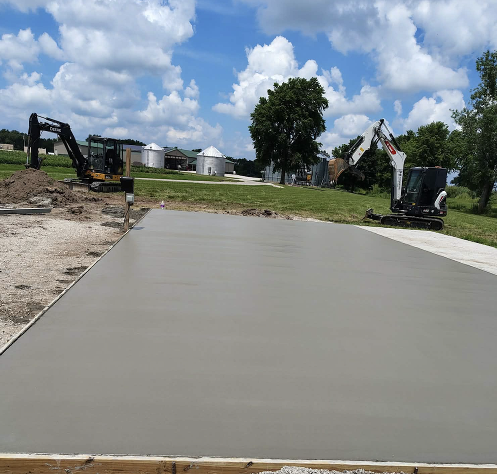 Concrete project and site preparation by 3D Excavating with excavators working on a residential property in Illinois.