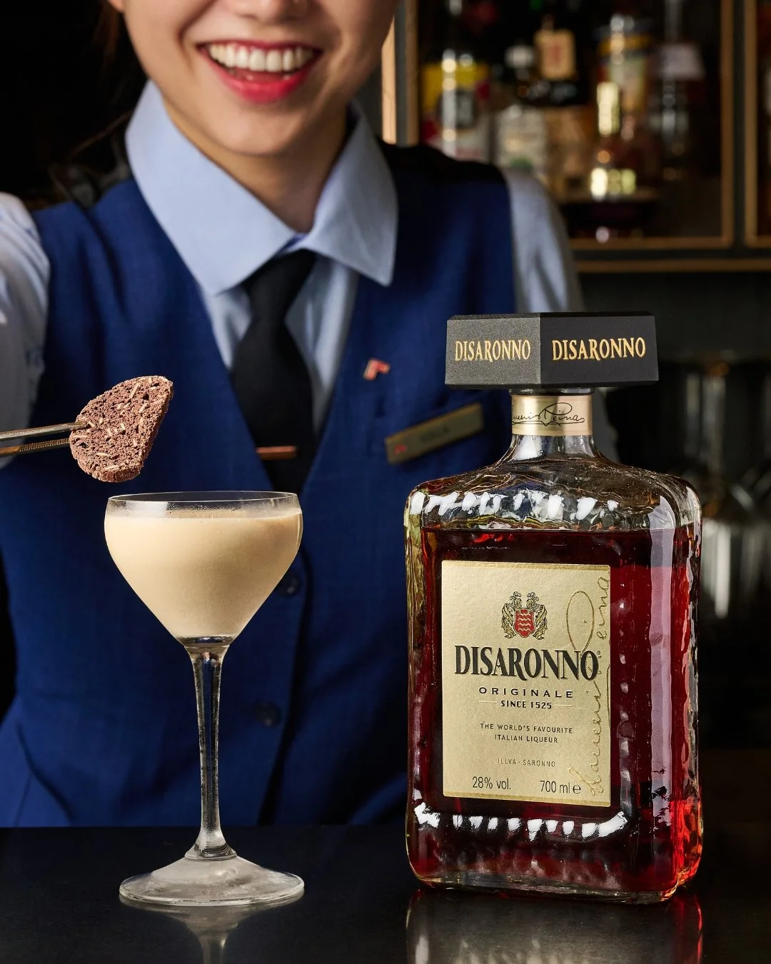 A sweet escape, high above the city on Level 70.

For Disaronno Godfather Week, discover Biscotti &mdash; a rich blend of Diplomatico Mantuano Rum and Disaronno Originale, layered with cacao brown liqueur and caramel syrup, finished with a biscotti c