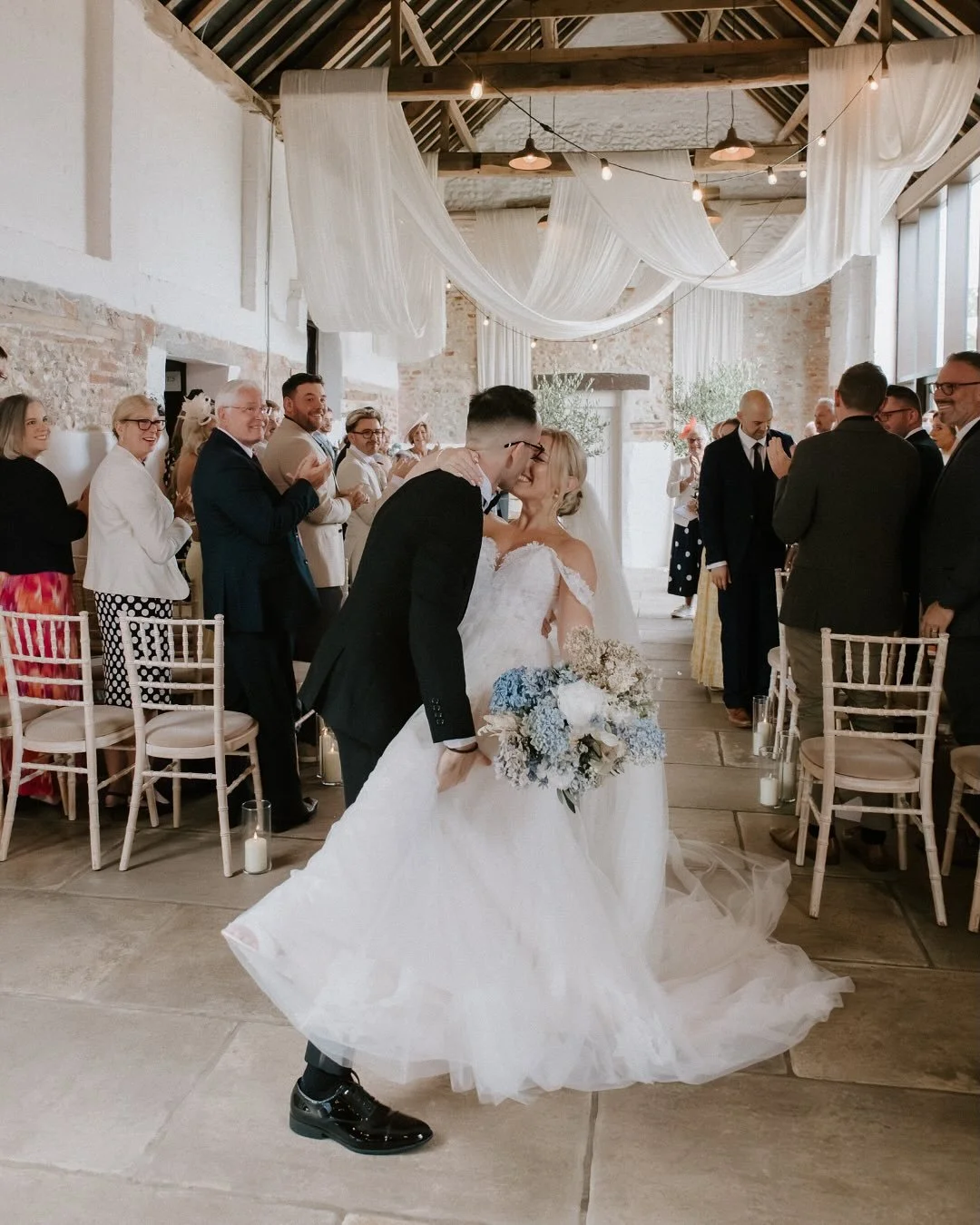 A dip kiss post ceremony? Completed it, mate! Still dreaming about S+A’s perfect day at @curdshallbarn!
.
.
Let’s create unforgettable moments for your wedding, too! DM me to book your session!
Photography: @photographyolivebranch
Venue: