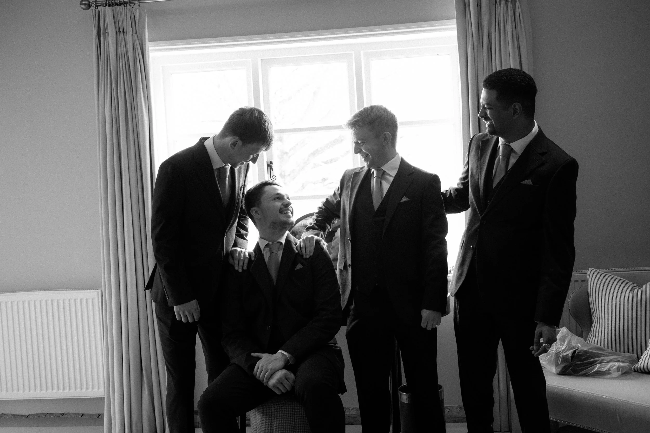 copdock-hall-wedding-groomsmen-prep-group.jpg