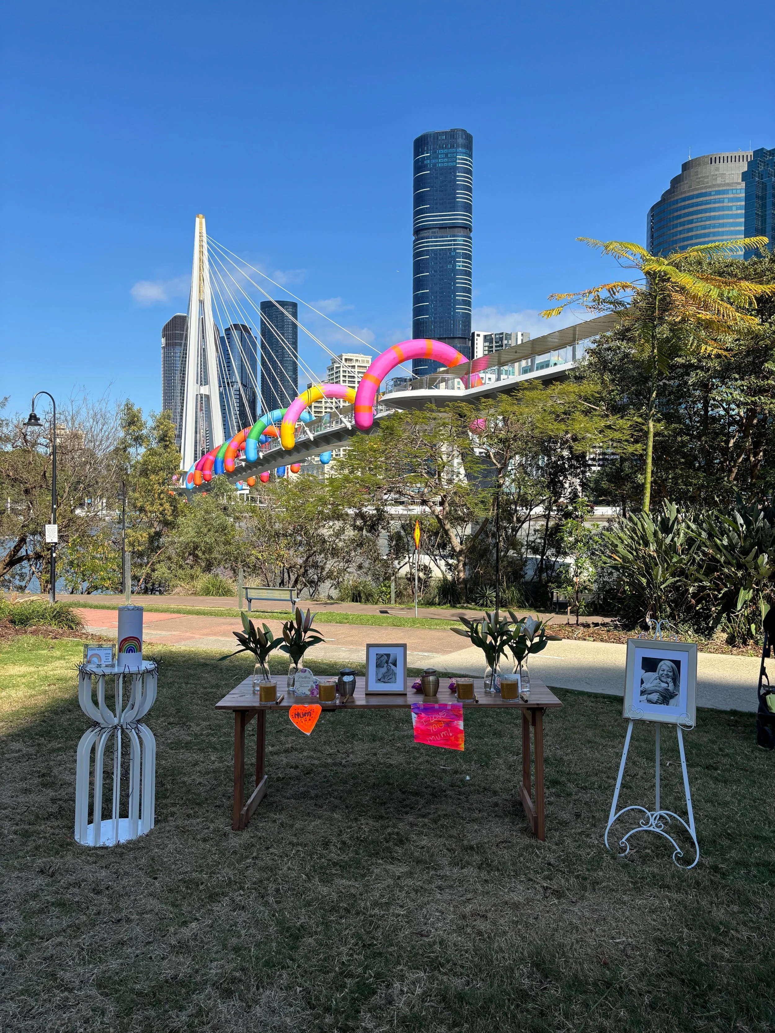 A memorial in a public park, featuring an alter made of tributes to the deceased.