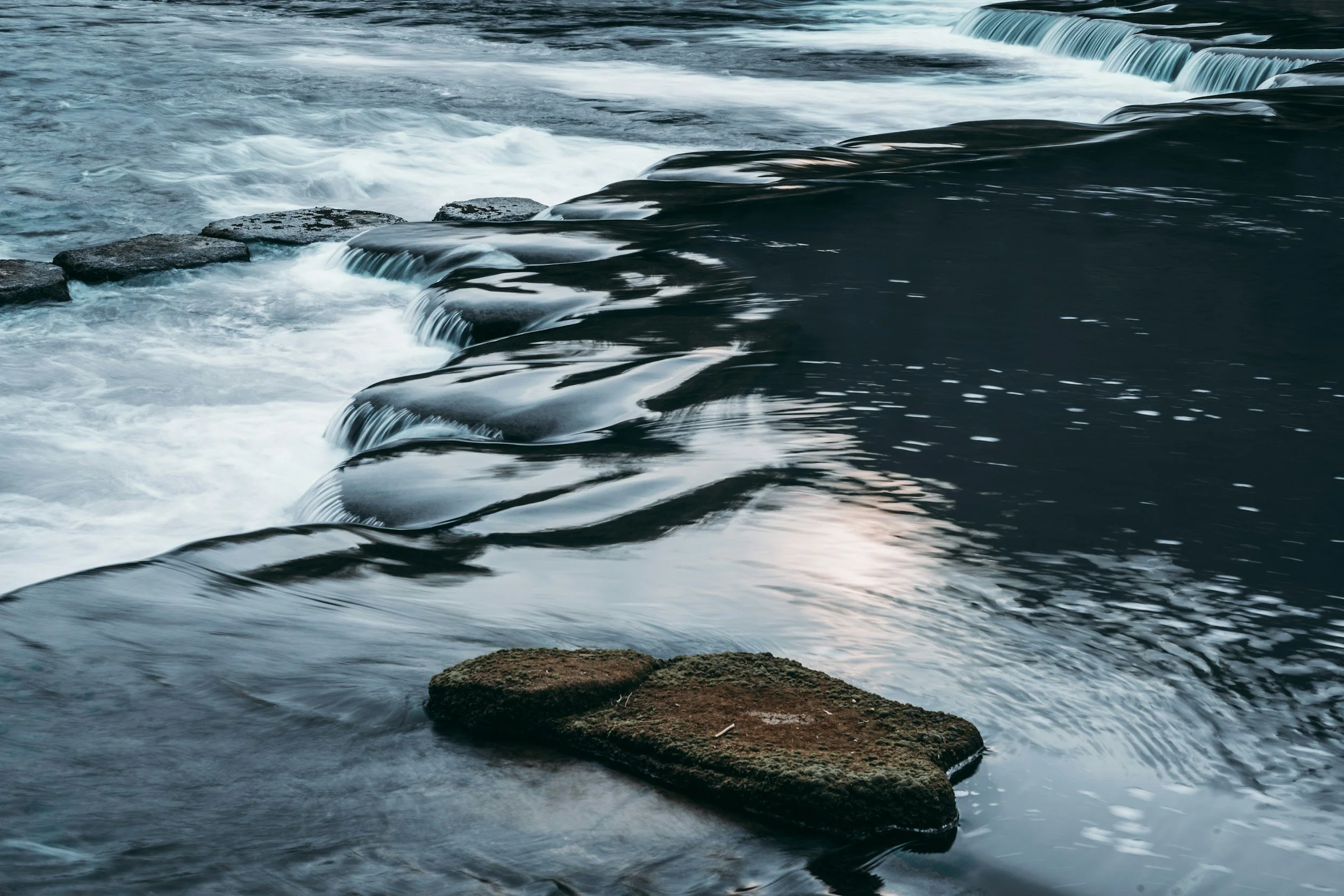 Stepping stones crossing a river fall