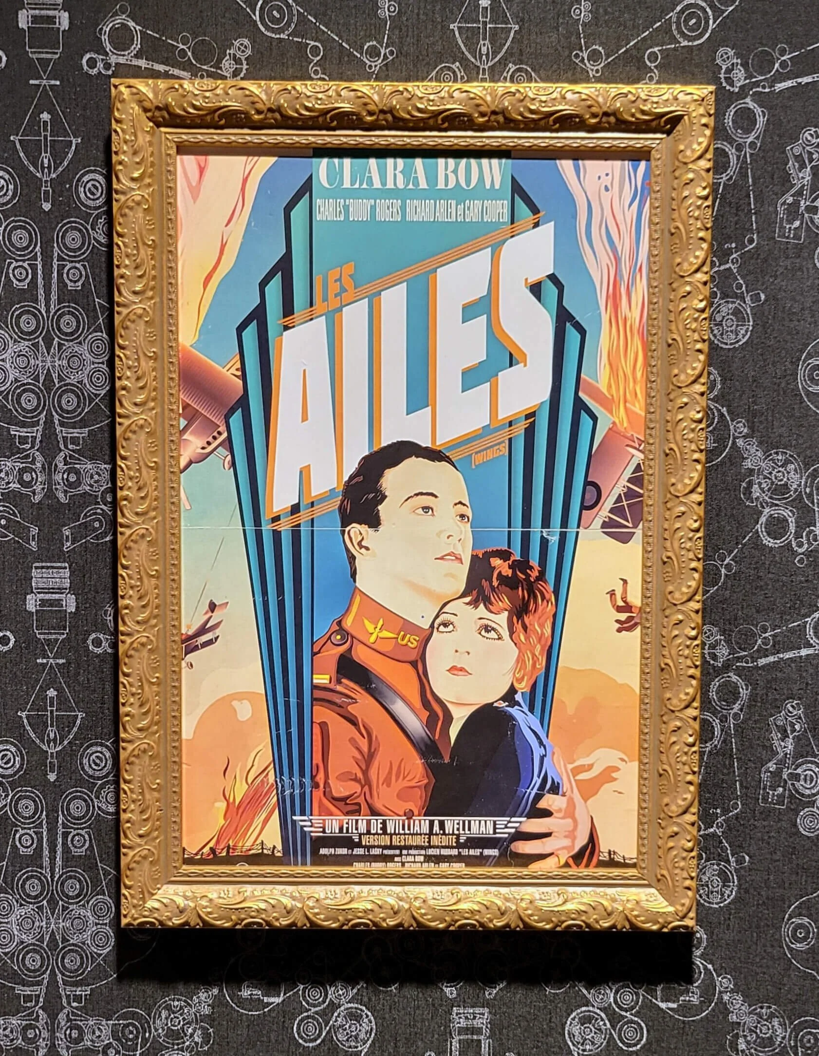 Framed vintage poster titled "Les Alies" featuring a man in a military uniform and a woman, with aircraft and explosions in the background, associated with the film by William A. Wellman.