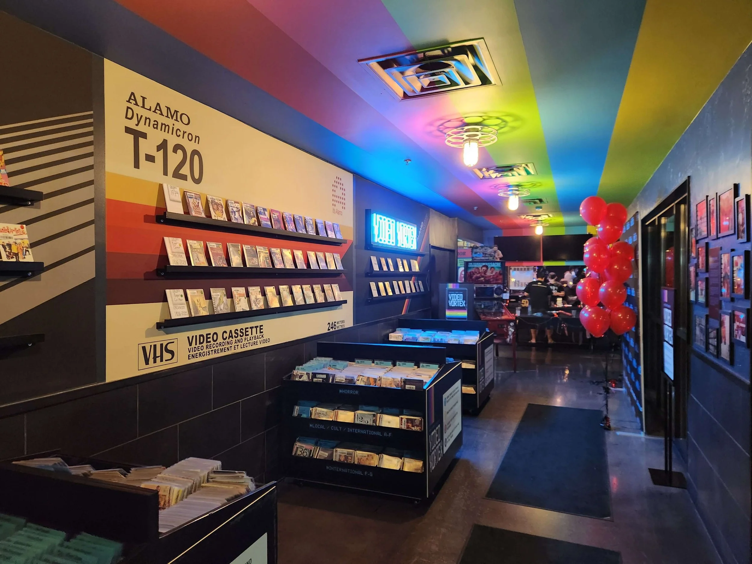 VHS Wall: A wall of actual VHS tapes, blending nostalgia with design.