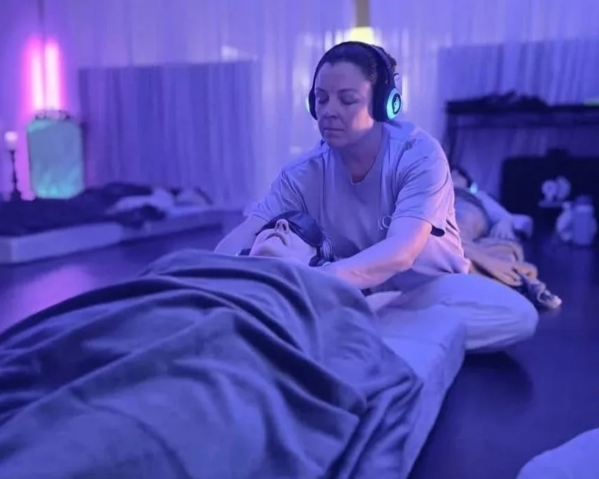 Woman experiencing emotional release during breathwork session with peaceful expression