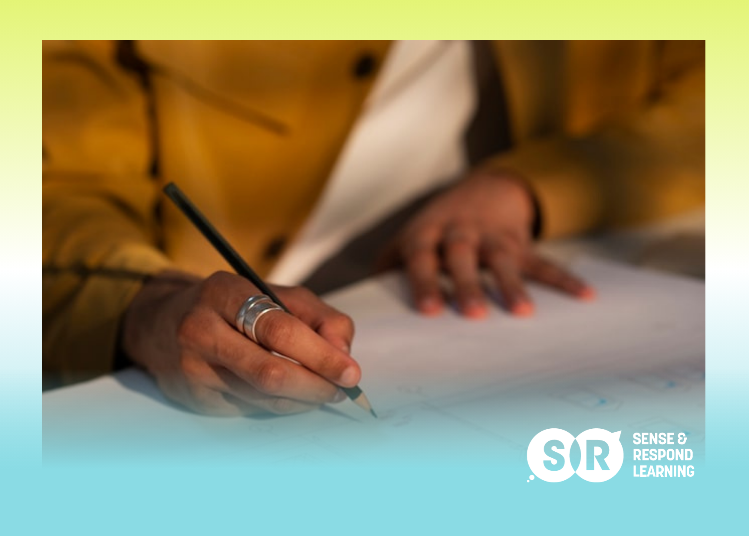 UX designer's hand sketching a rough wireframe with a thick marker on paper