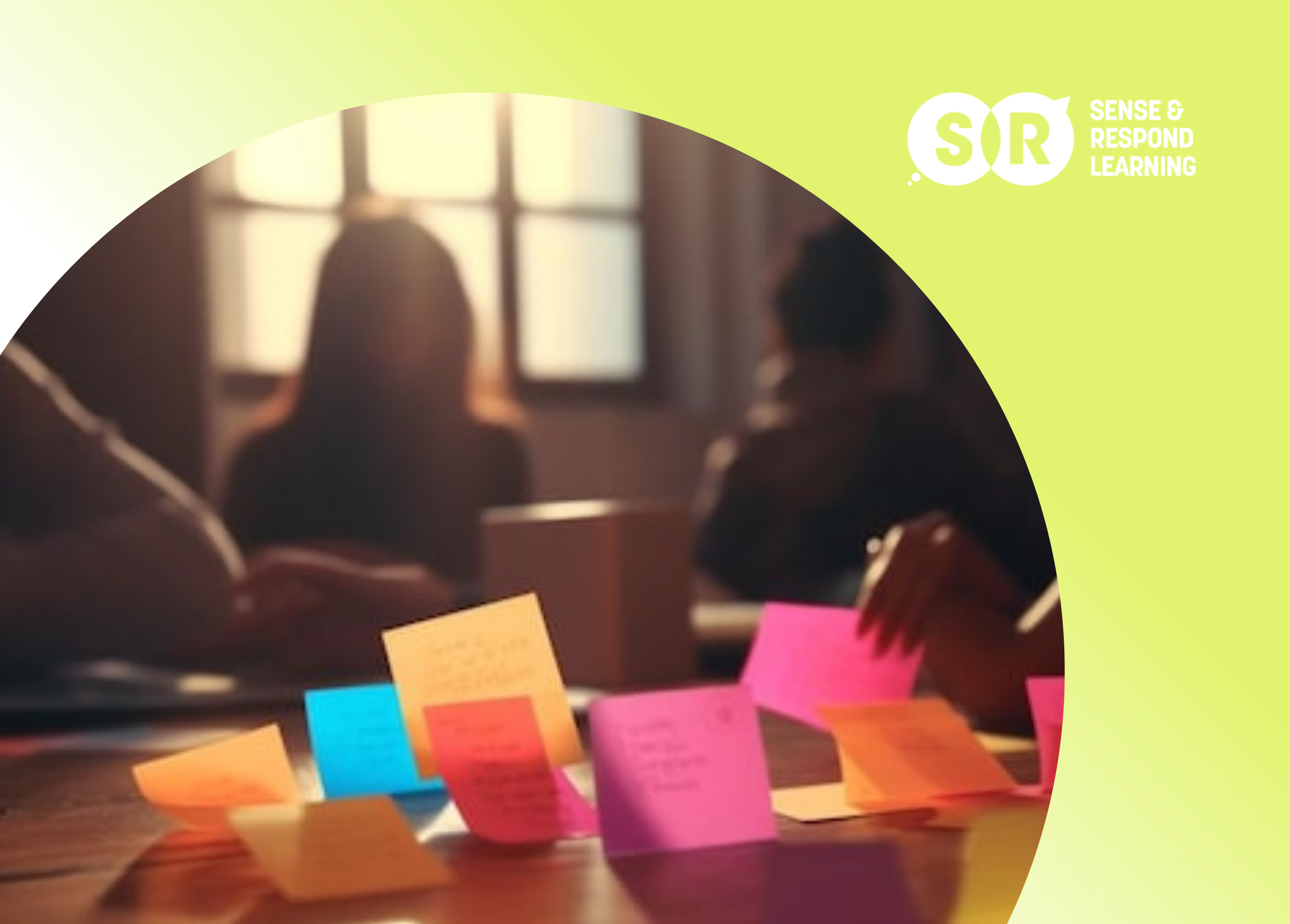 Team members sharing and organizing sketched ideas on a wall during a workshop