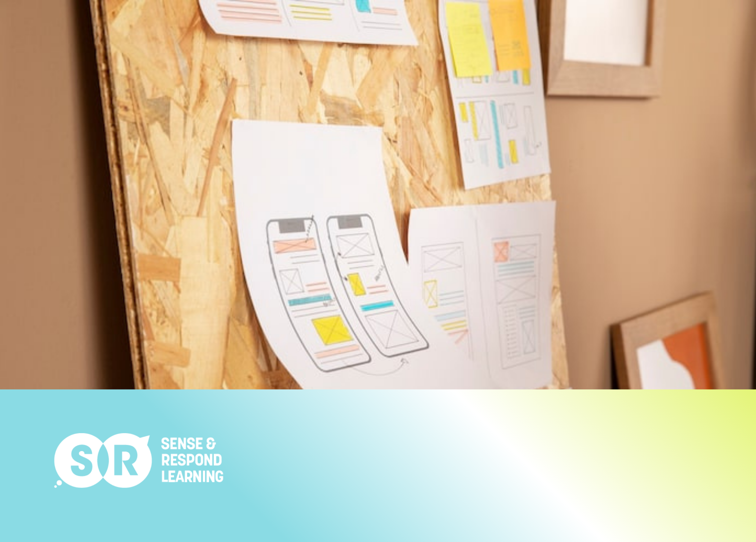 Designer holding low-fidelity paper prototype during a user testing session