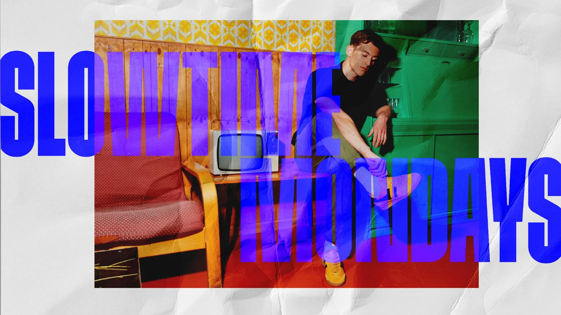 GlenSlde brochure resting on a table with a black cover featuring a white G logo and a small green dot, partially open to reveal a photo of a man inside.