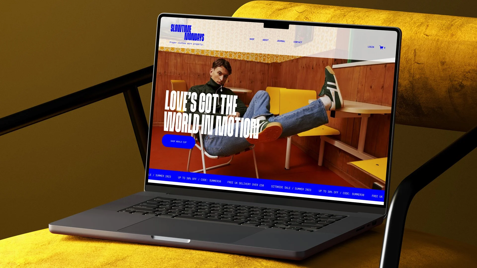 Open magazine showing interior design images with bright green and black background pages