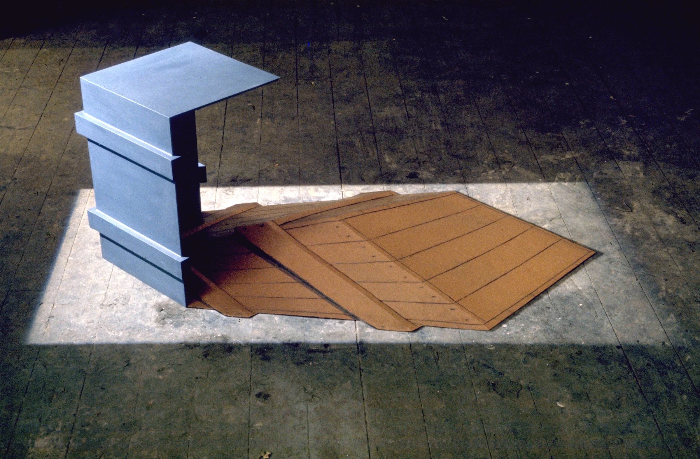 Shadow Crate II. Wood, fibreglass and paint on green baize with framing spotlight. 72' long. 1972