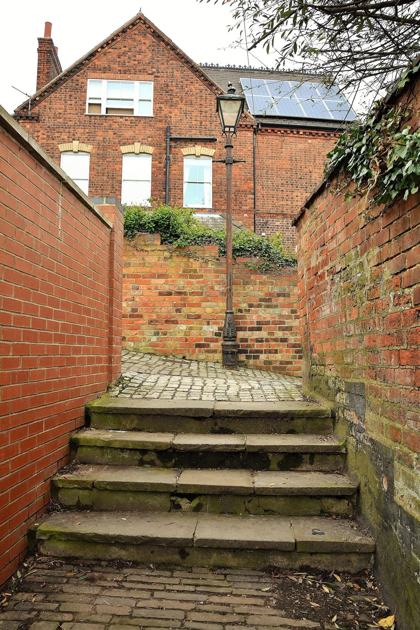 East's Passage. Yes this liitle ginnel has a name! Its even named on an 1879 City Surveyors map. a joh East lived along Motherby Hill and was a land owner here. The wall on the left was rebuilt in 2012 follwing the construction of Erinalice Court. 
