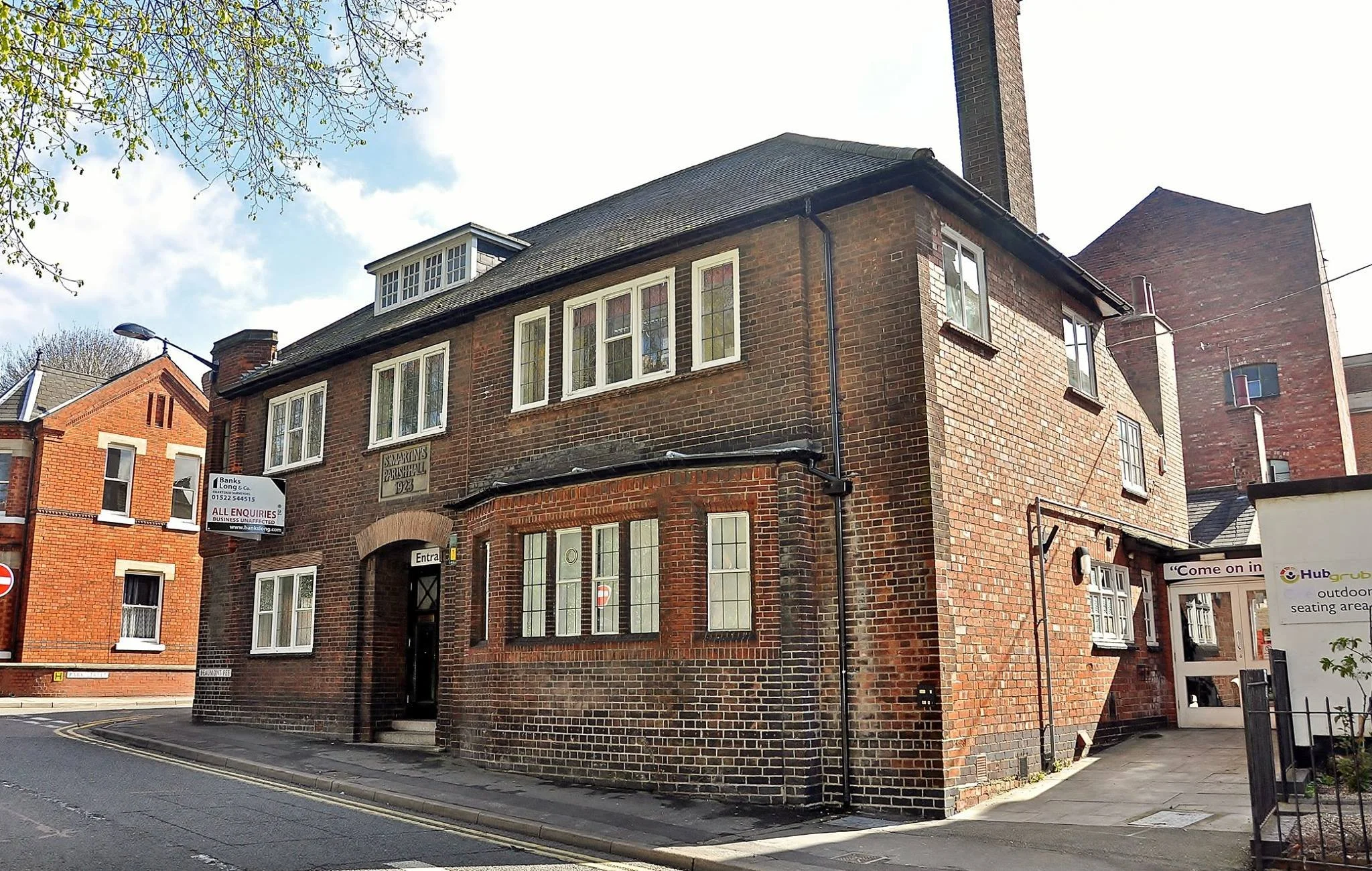 The former St Martin's Parish Hall.

 The former St Martin’s Parish Hall on Beaumont Fee was built in 1923 for Canon Akenhead, replacing an earlier Catholic chapel. It later became an adult education centre operated by the University of Nottingham.

