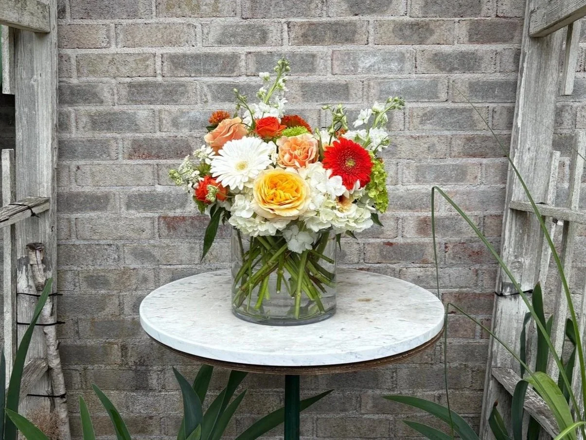 A bespoke, hand-tailored vintage rose and white tulip arrangement by Quogue Flower Shop, perfect for your loved ones or a last-minute meaningful gift with same-day flower delivery across the Hamptons.