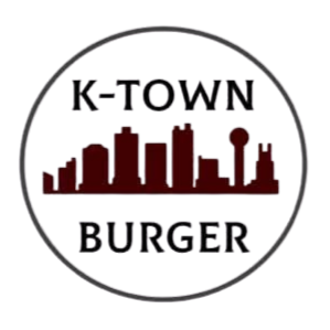 Logo for K-Town Burger featuring a red city skyline of Knoxville TN silhouette inside a black circle.