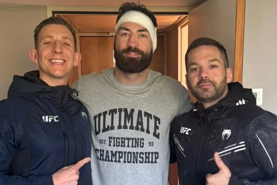 UFC fighter Paul Craig with strength and conditioning coach Adam Lusby post UFC win