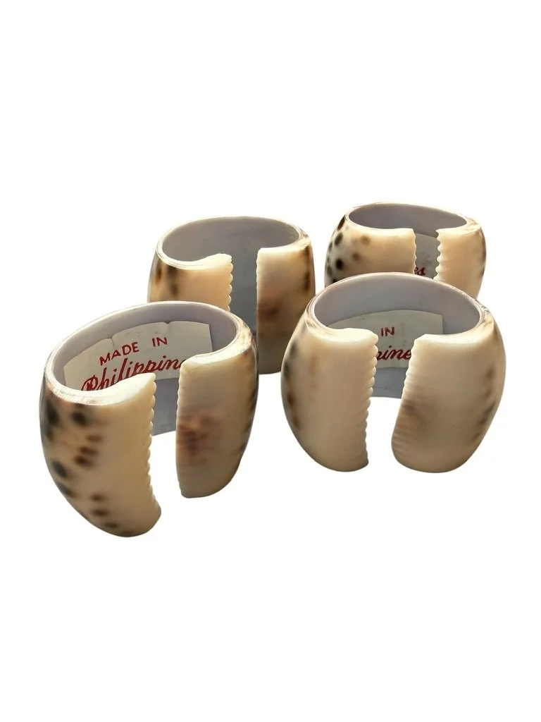 Set of 4 cowrie shell napkin rings.