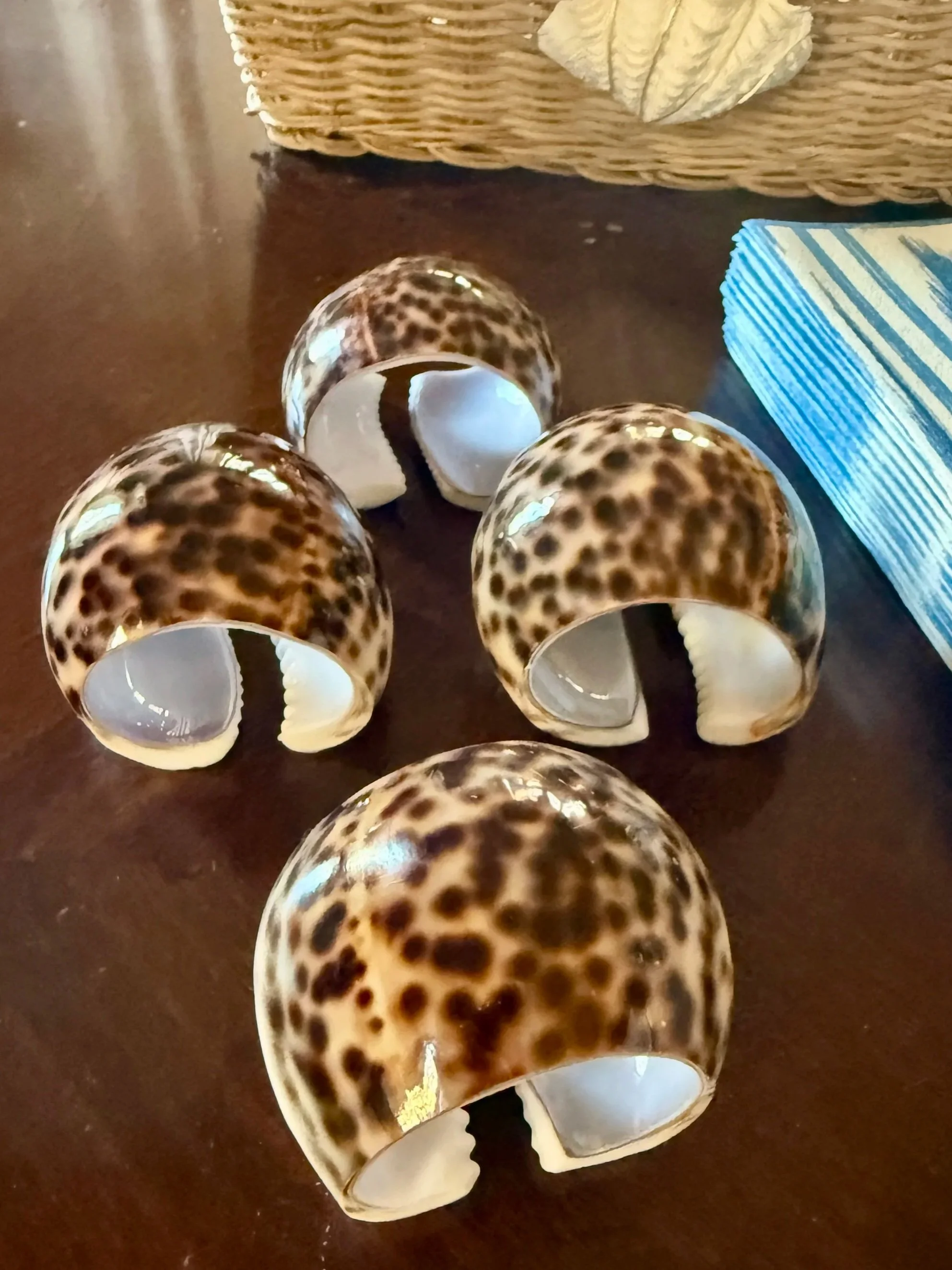 Cowrie shell napkin rings for coastal entertaining.