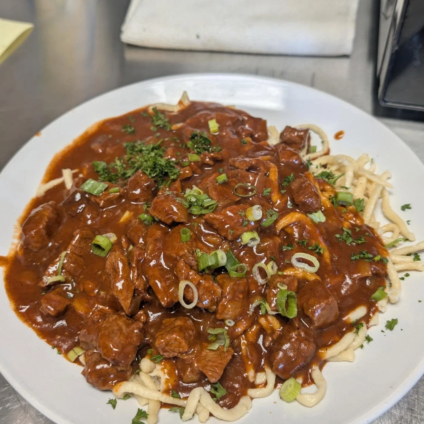Meet the Goulash! A beef stew cooked until super tender with bell peppers and lots of flavor. Served with house made Sp&auml;tzle. (German egg noodles). We would recommend a dark wheat beer with it. Prost