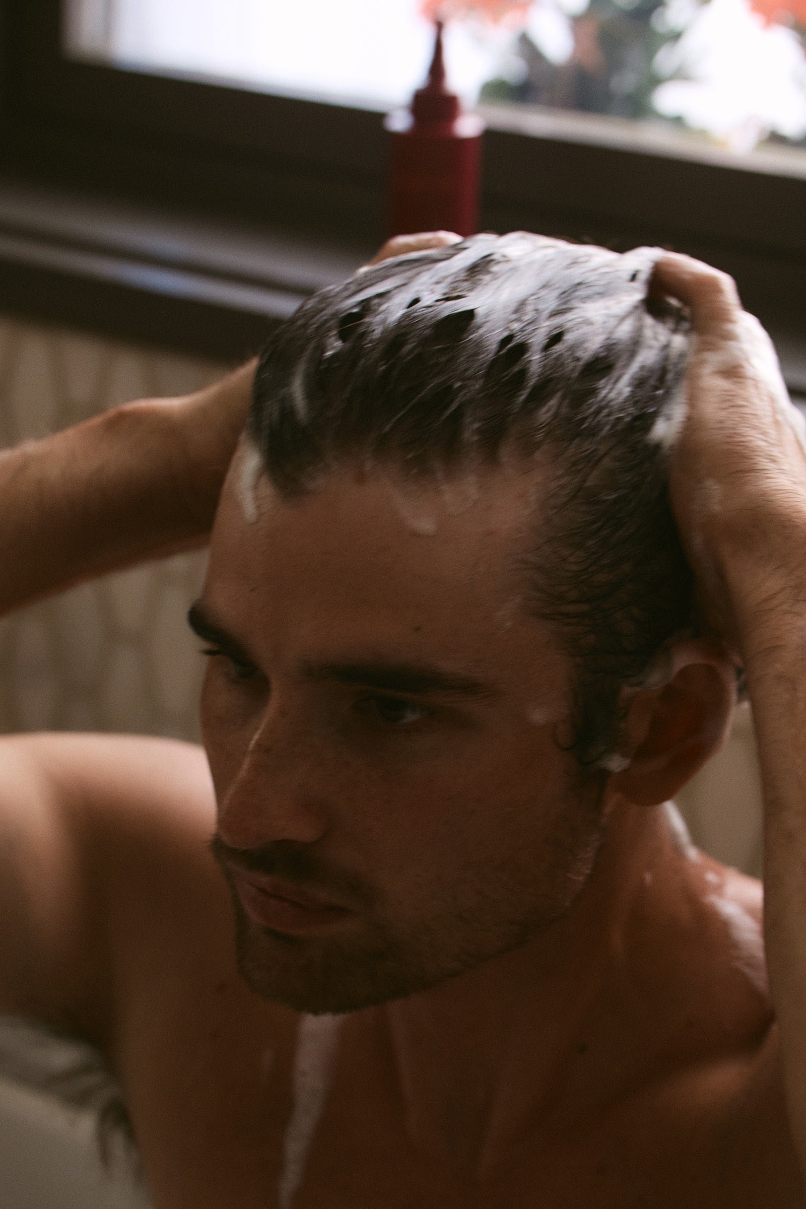 man using a shampoo for healthy scalp