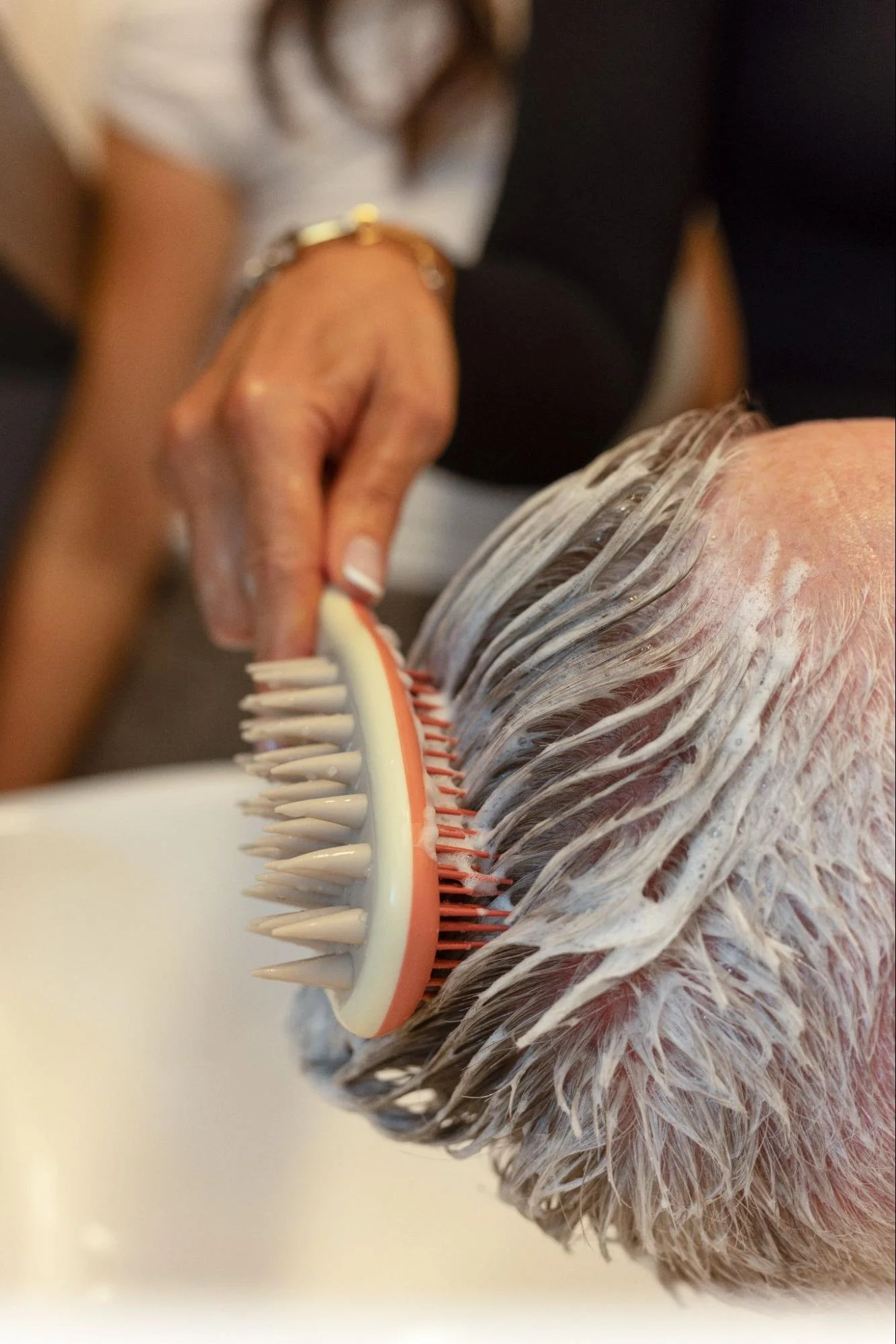 man getting a double cleanse hair wash