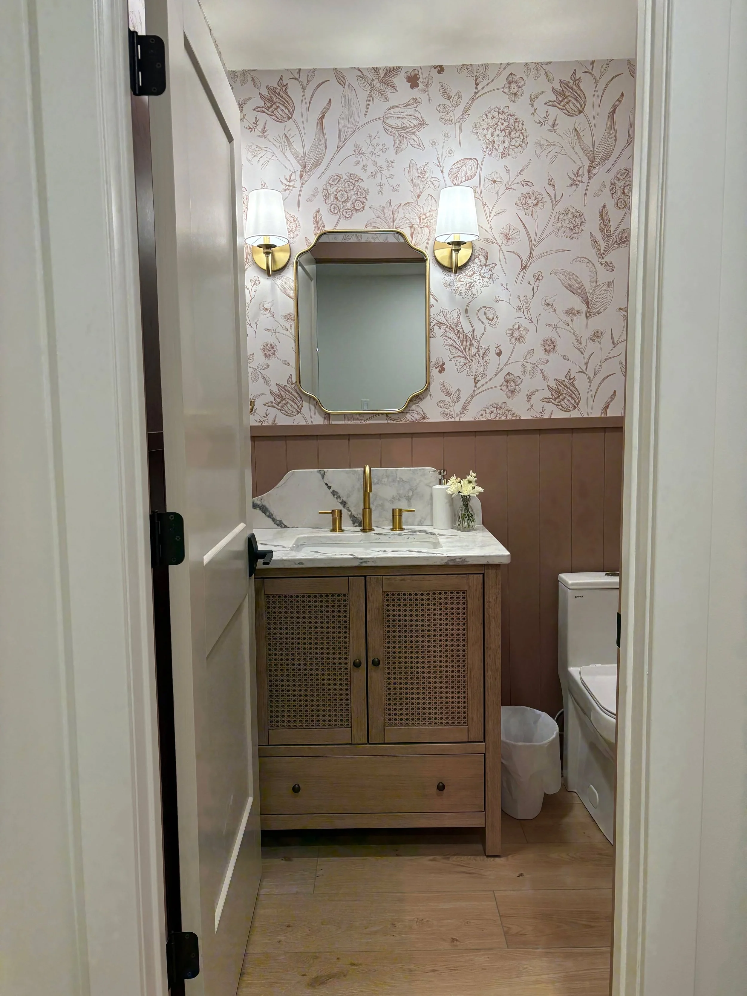 To kick-off our #RanchRemix reveal, we are starting with the powder room. We love designing powder rooms as they are spaces where you can turn up the volume and have some fun! We did just that by incorporating large scale floral wallpaper, painted pa