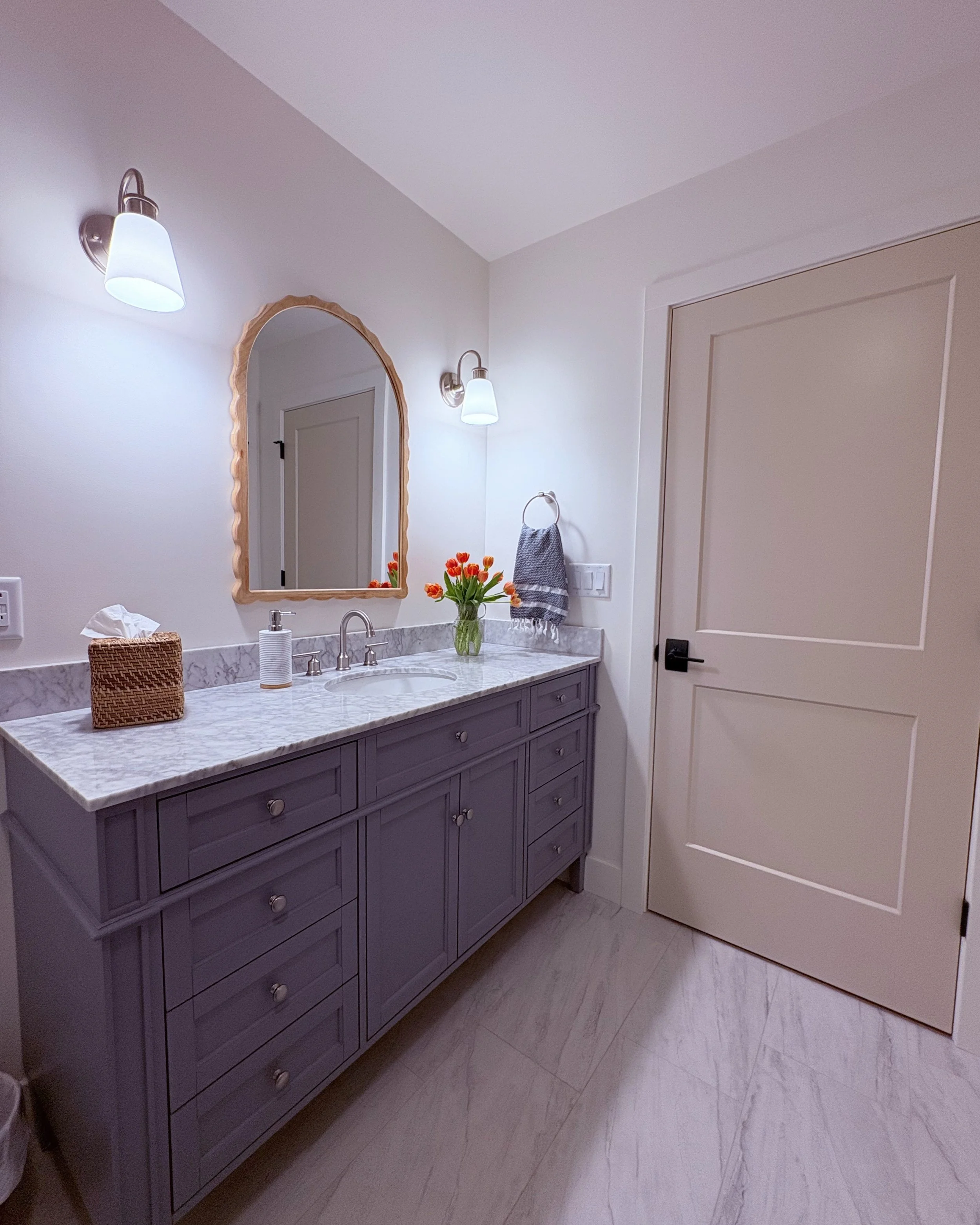 So fresh and so clean, clean! The hall bath at the #RanchRemix is light and bright with a pallet of grey, white, and natural wood tones. It's calm and peaceful...until it's kids' bathtime! But the order is quickly restored with plenty of storage in t