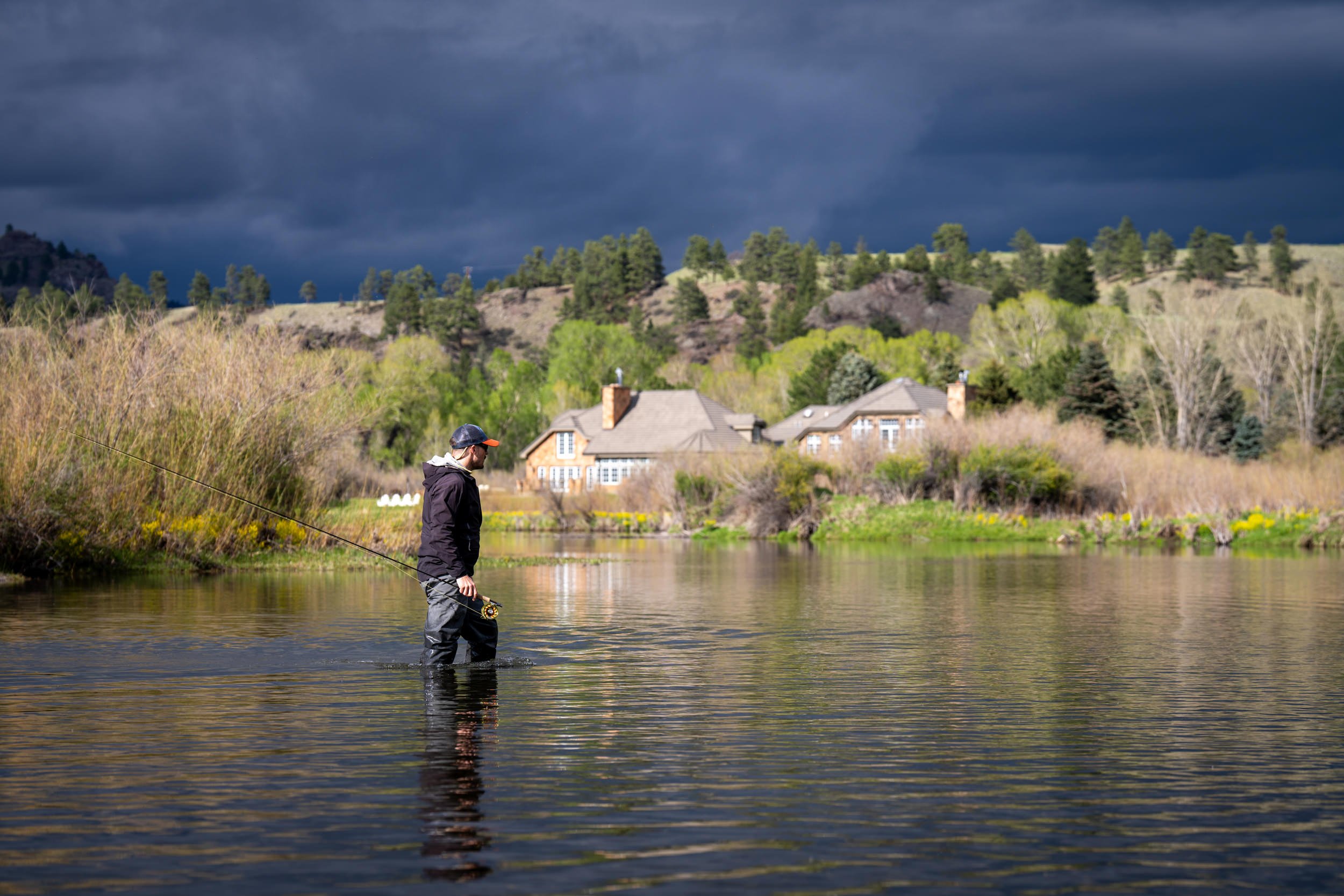 Angler fishing the Missouri River near Rivenrock under a stormy sky