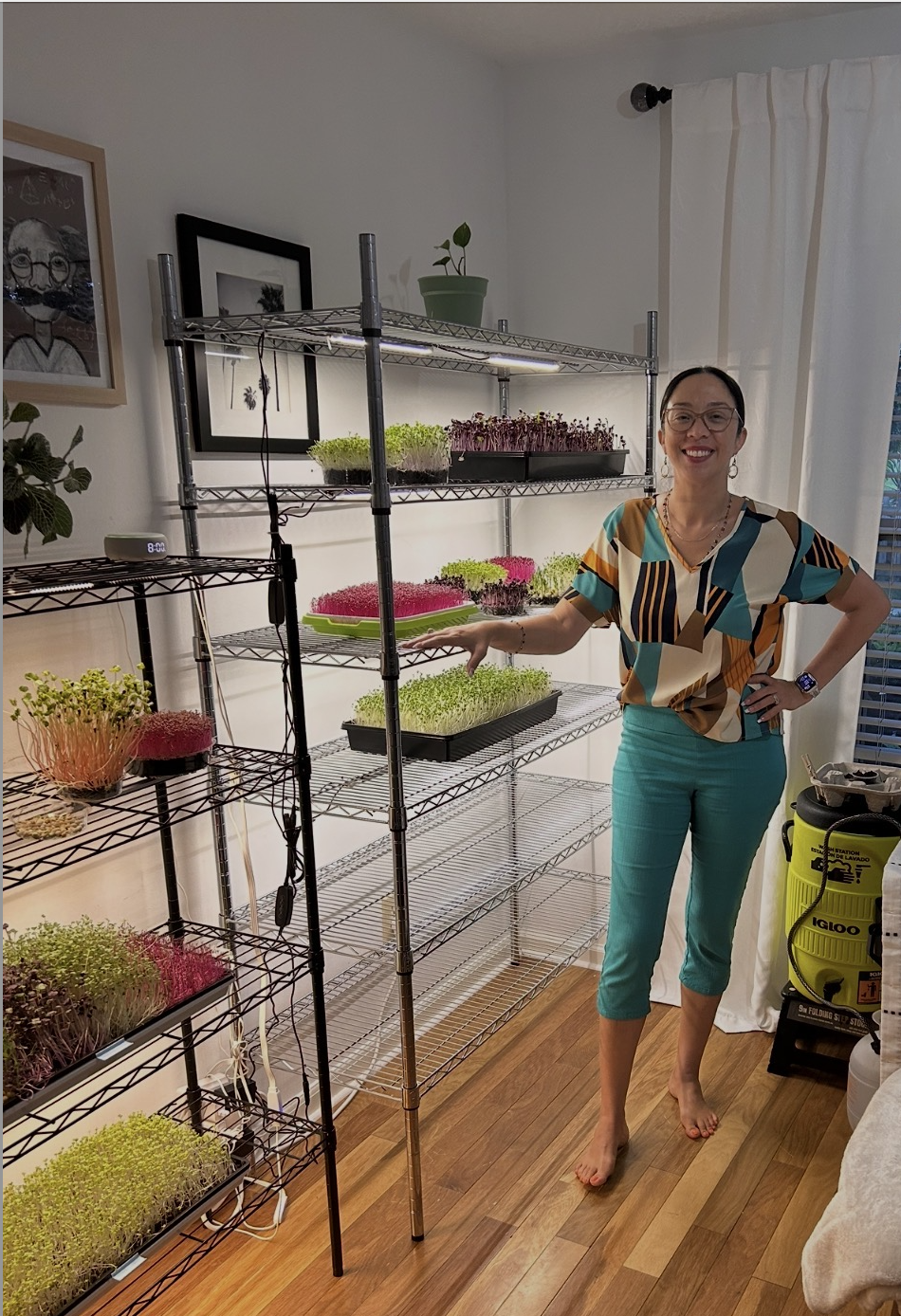 Jennifer with microgreen rack
