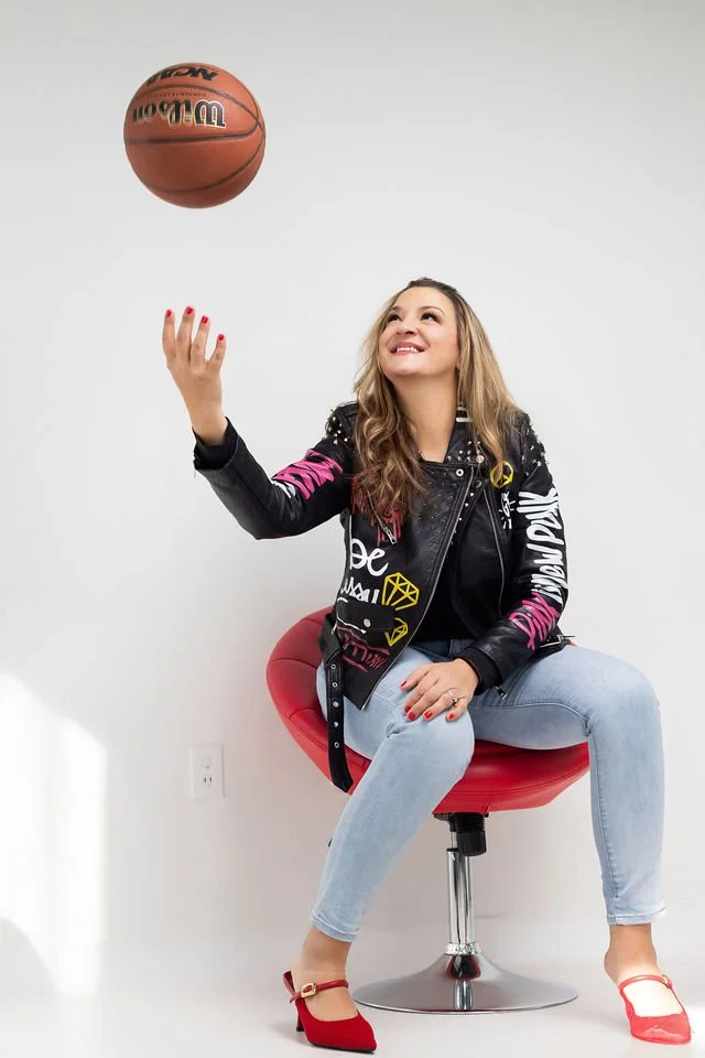 Caryn Grafton throwing a basketball in the air