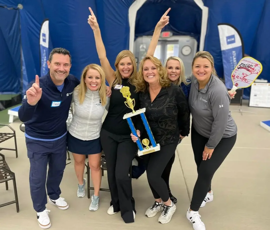 Caryn Grafton and her sales team receive a Top Producer award