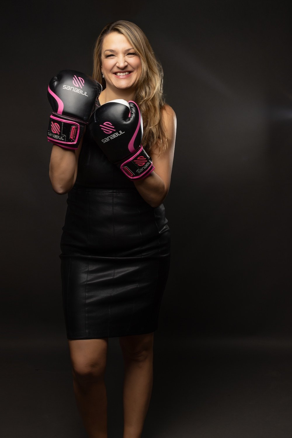 Caryn Grafton standing, wearing boxing gloves