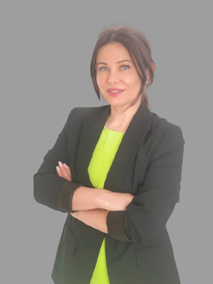 Portrait of a woman wearing a jacket, smiling against a gray circular background.