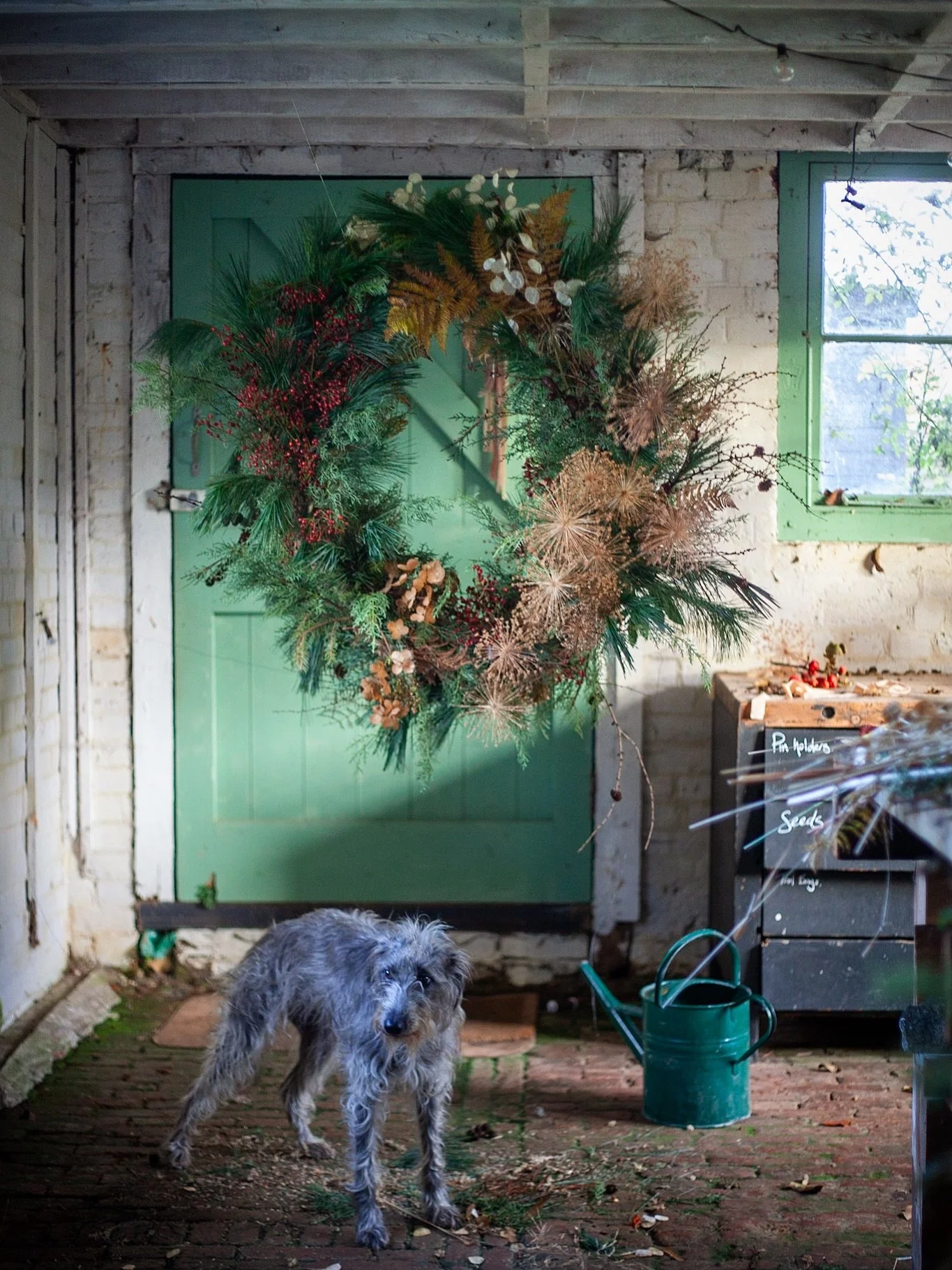 Ending the weeks of wreath making with this supersized one.  Made on a hand made base of clematis vine from the garden covered with chicken wire so you can just shove the stems in as you please and have fun with the placements. 

I had it hanging up 