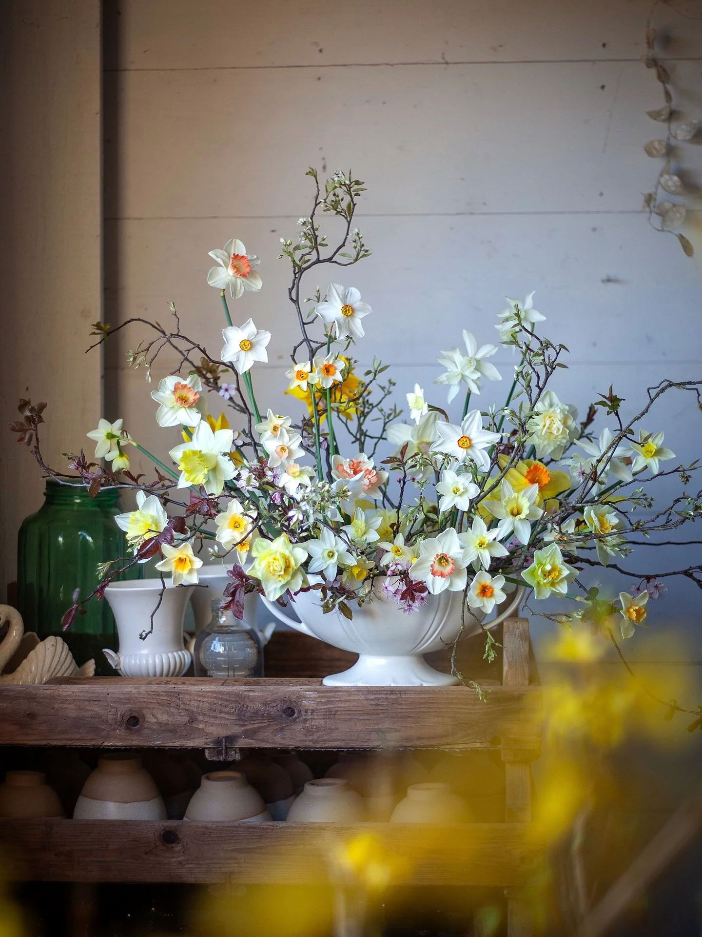 All the daffs, with a little blossom to add structure, framed with that zingy yellow forsythia. 

Made in a favourite vintage vase with a ball of chicken wire and a long pin frog for support. 

This is actually the first project in my upcoming book L