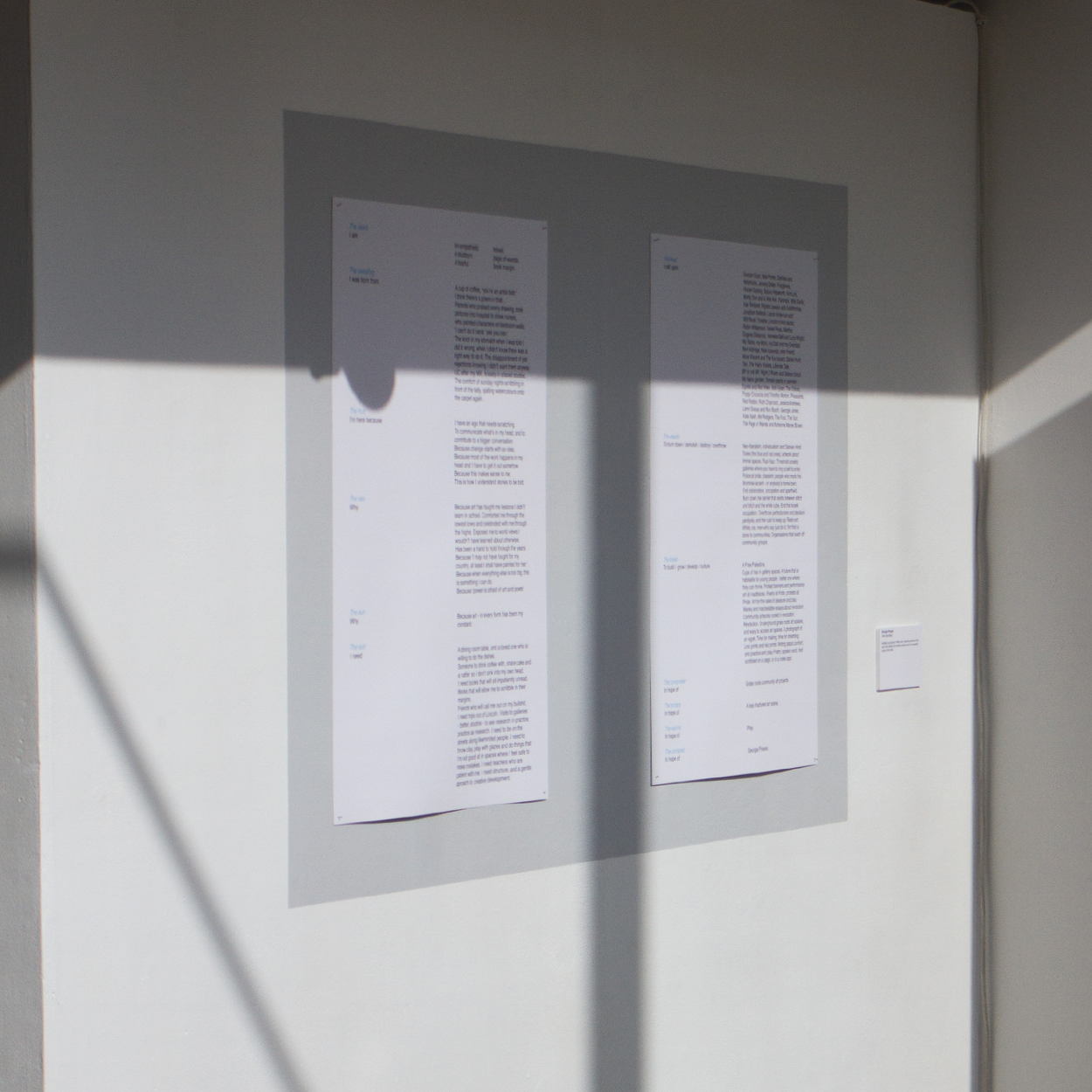 Two pages containing Georgia Preece's Manifesto mounted on a wall, as part of a legacy exhibition at the university of Lincoln.