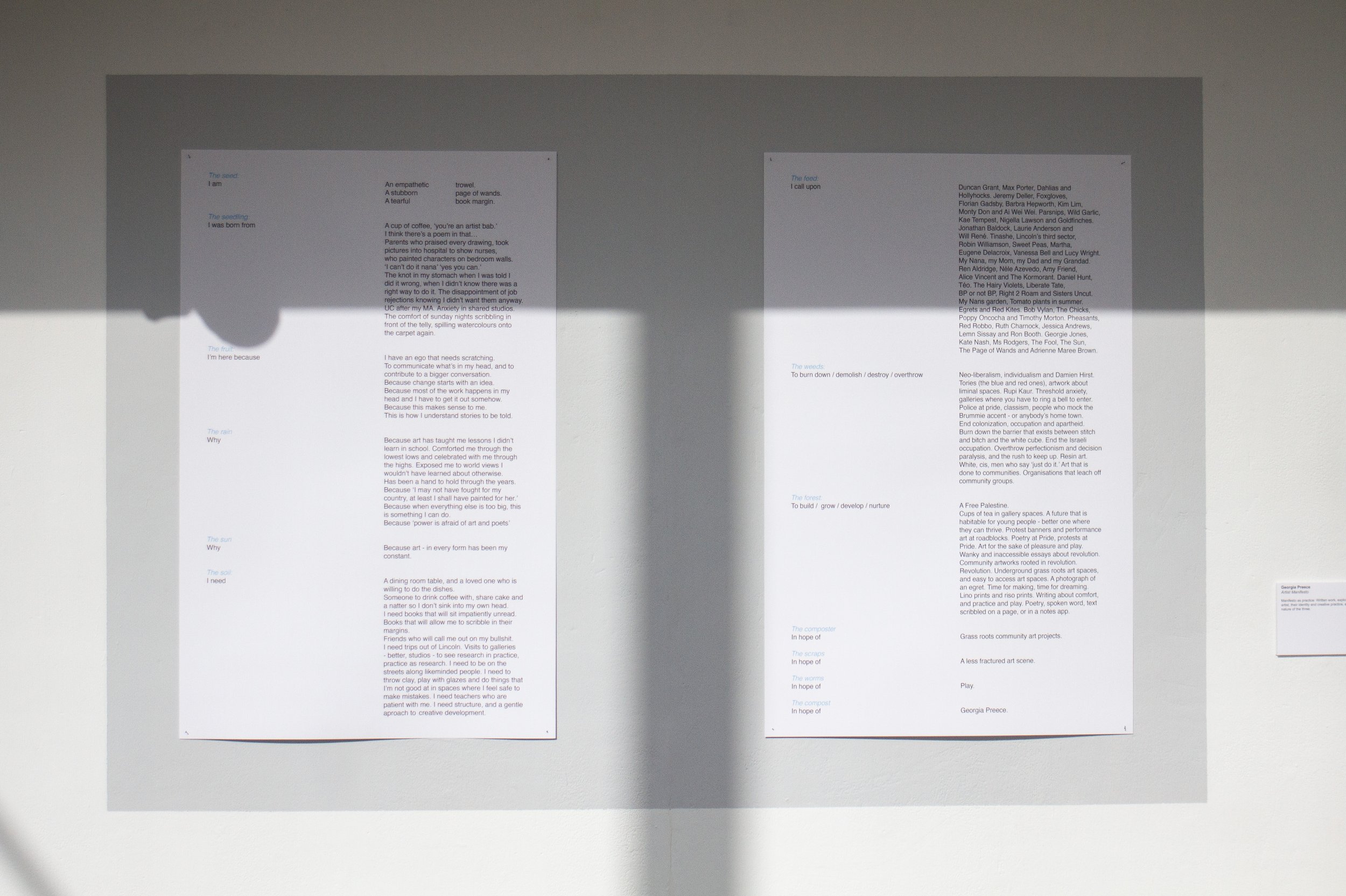 Two pages containing Georgia Preece's Manifesto mounted on a wall, as part of a legacy exhibition at the university of Lincoln.
