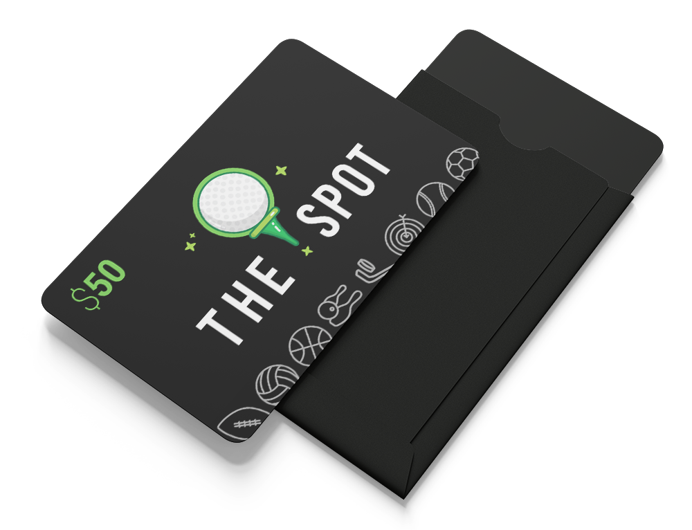 A black package with a $50 gift card inside labeled "The Spot" with a golf ball graphic, partially removed from the black envelope.