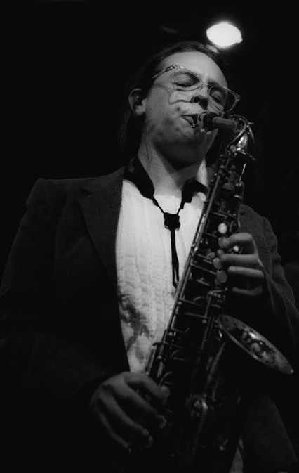 Black and white photo of a woman playing a saxophone