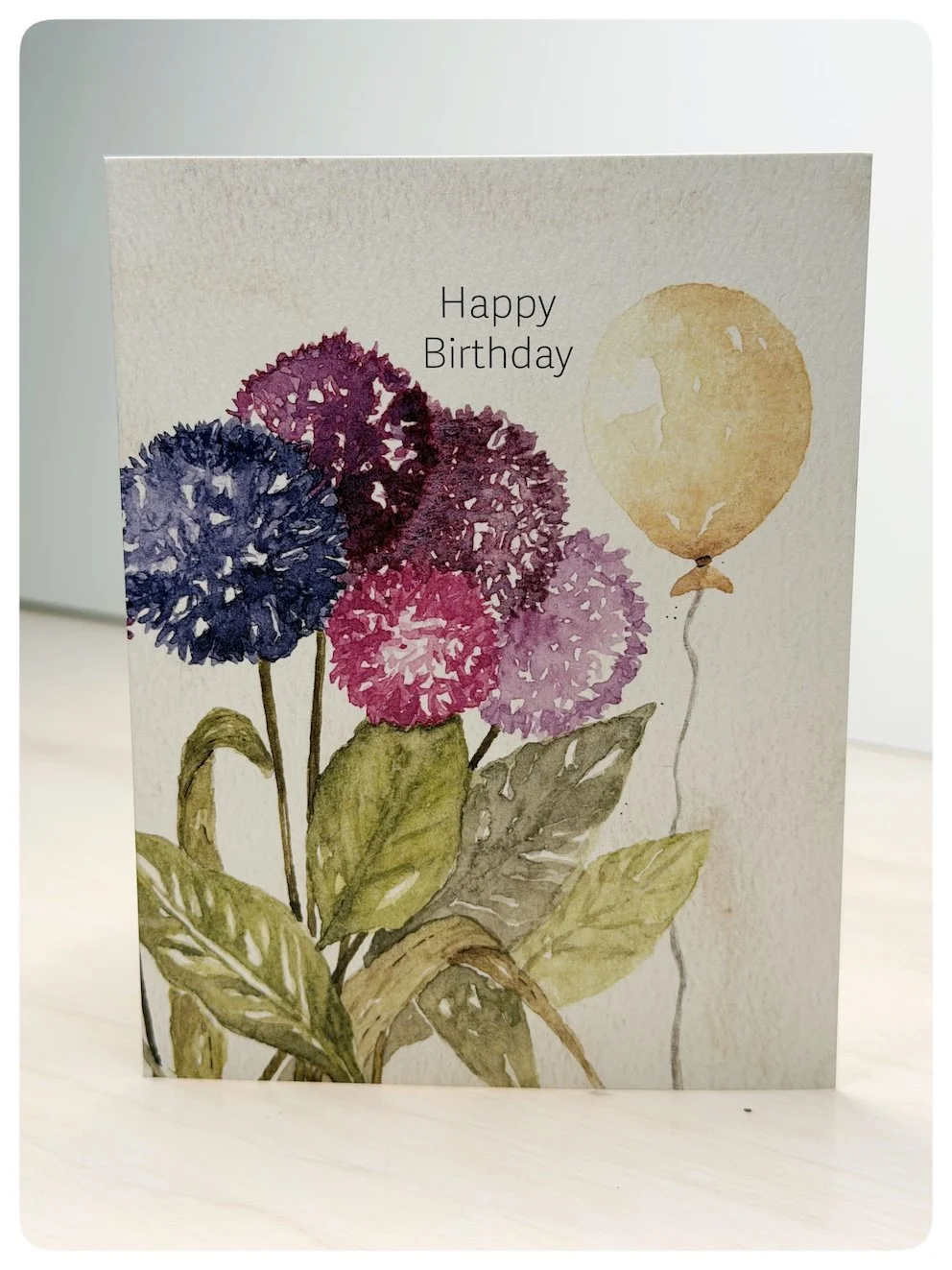 Floral birthday greeting card with watercolour alliums and golden balloon by Hannie Art