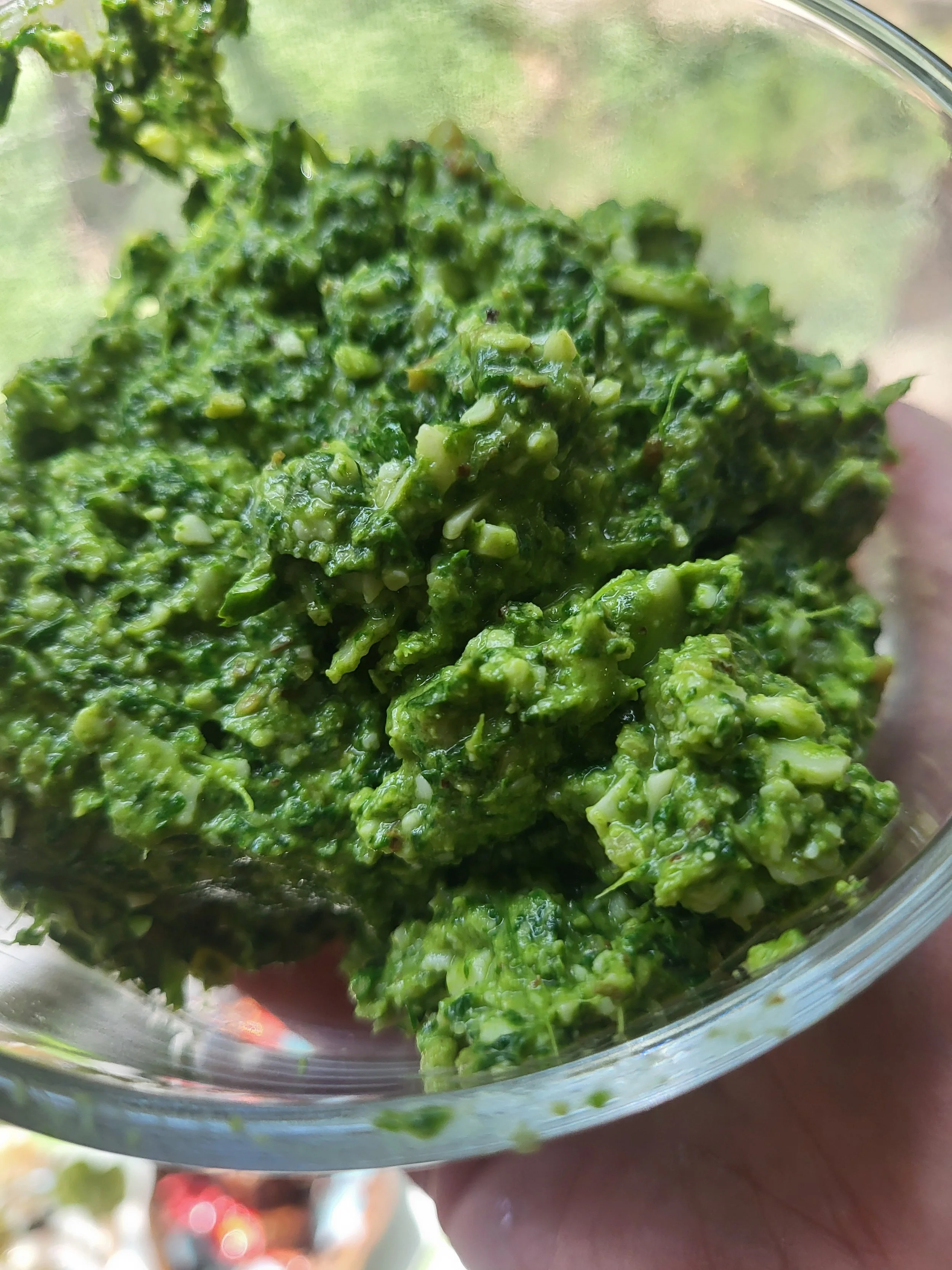 A bowl of bright green pesto