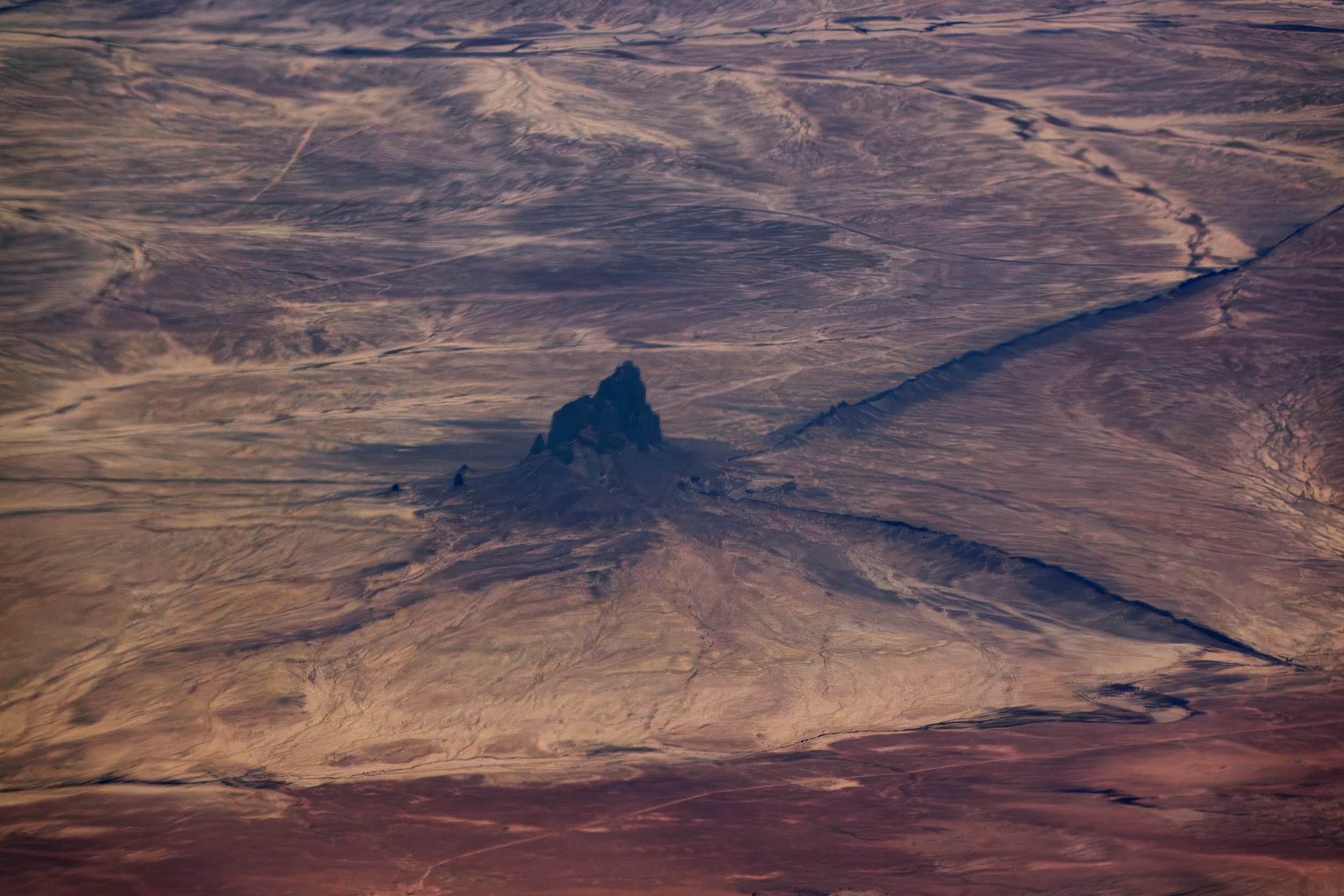 Shiprock, Northwestern New Mexico, sacred to the Navajo, this volcanic monadnock (482 metres) is 27 million years old.