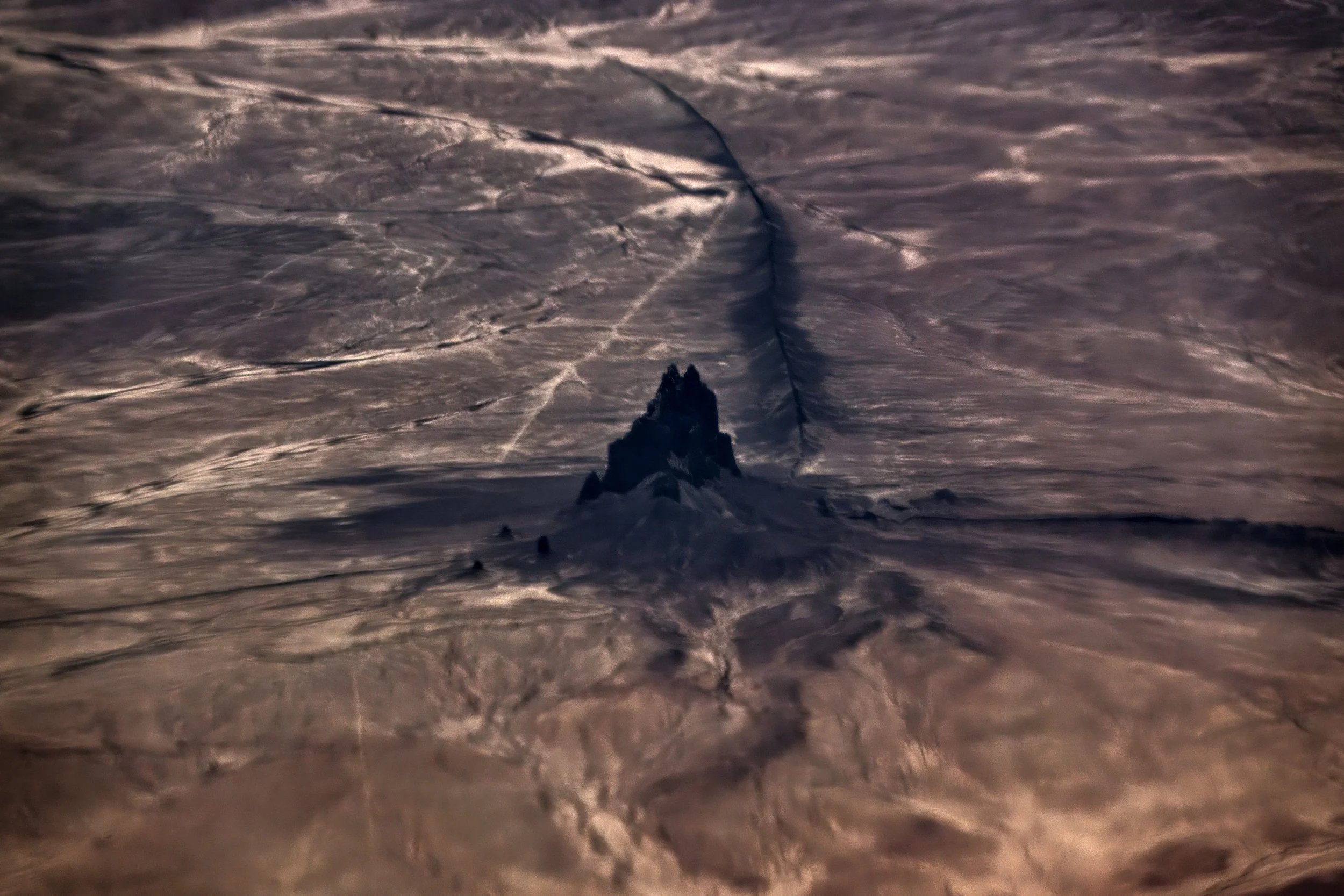 Shiprock, Northwestern New Mexico, sacred to the Navajo, this volcanic monadnock (482 metres) is 27 million years old.