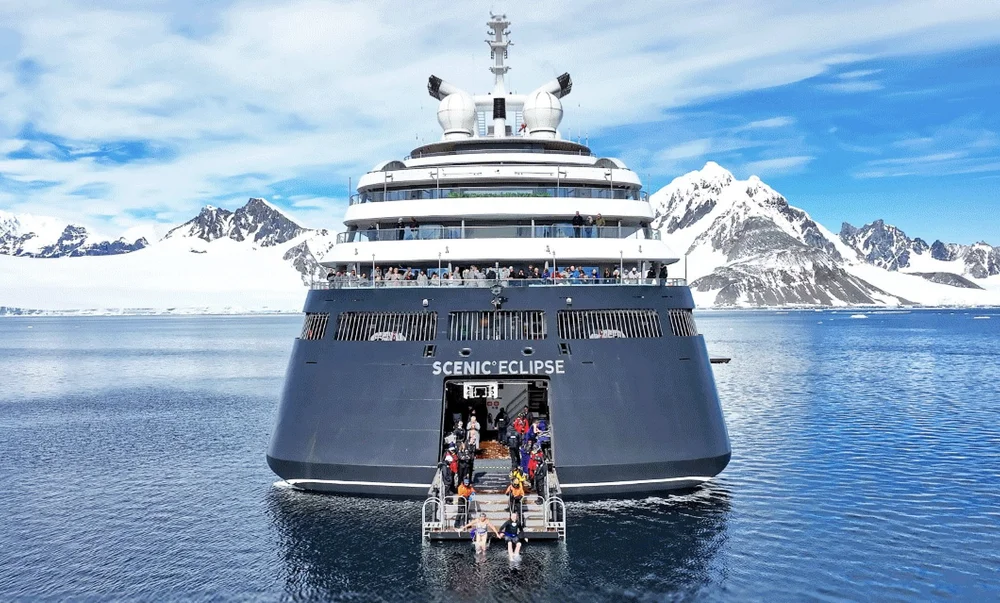 Scenic Eclipse with submarine on deck