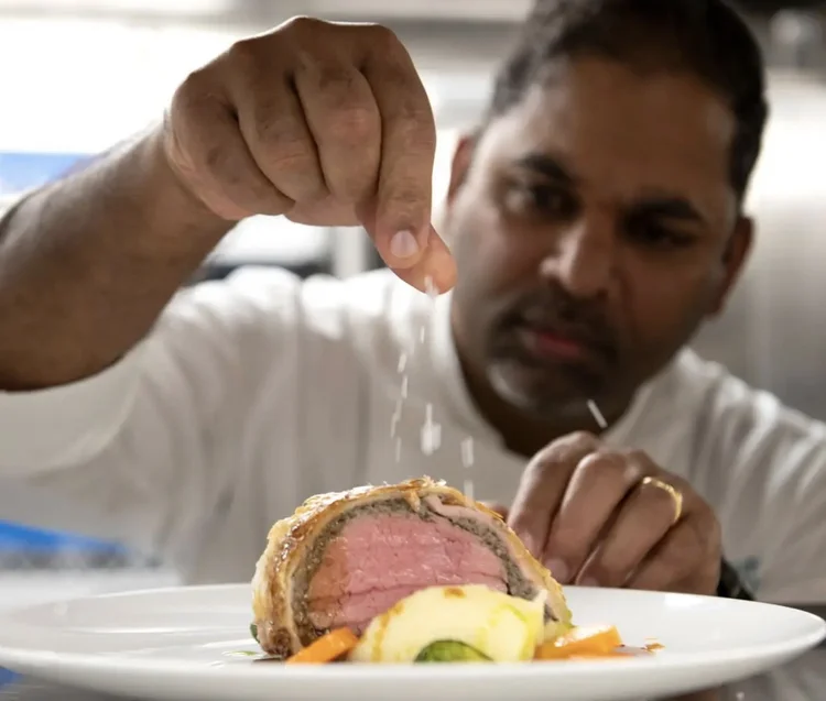 Chef preparing a dish aboard Swan Hellenic